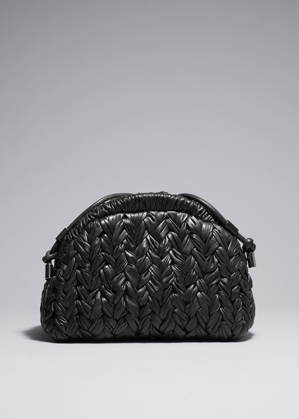 Bolso de mano de piel trenzada