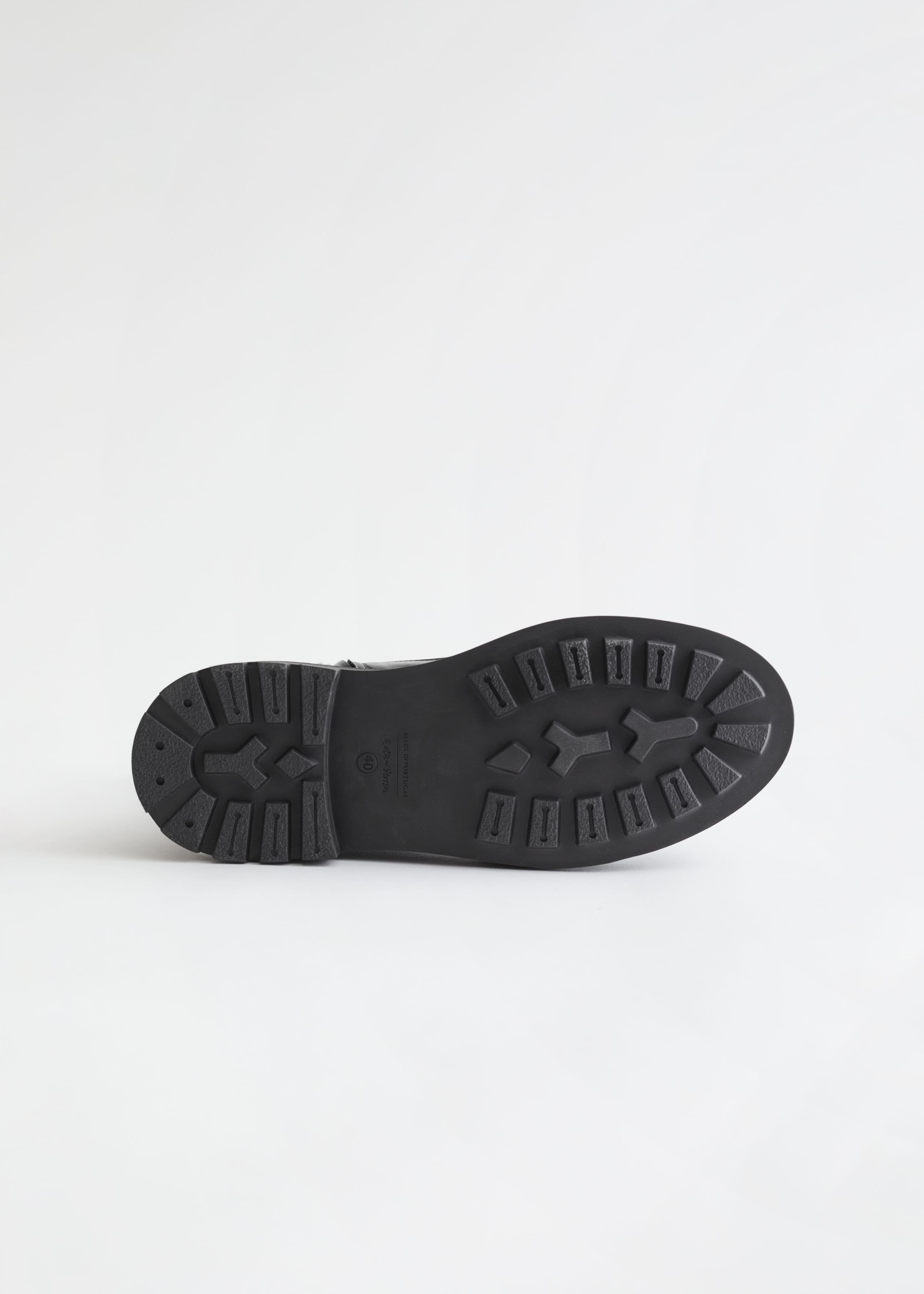 Bottines épaisses en cuir avec zip latéral - {{variantName}} - Descriptive Detail
