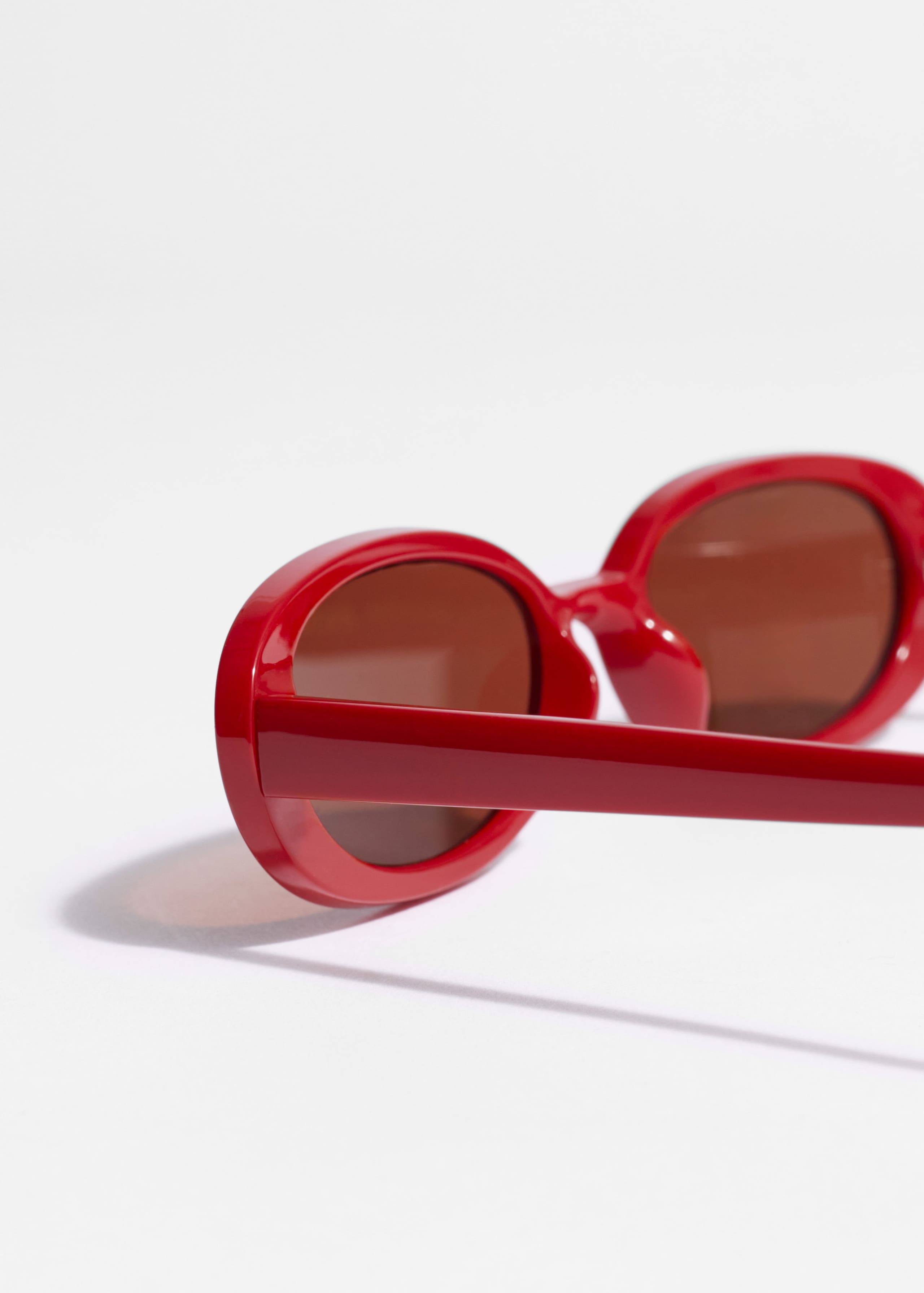 Slim Oval-Frame Sunglasses - {{variantName}} - Descriptive Detail