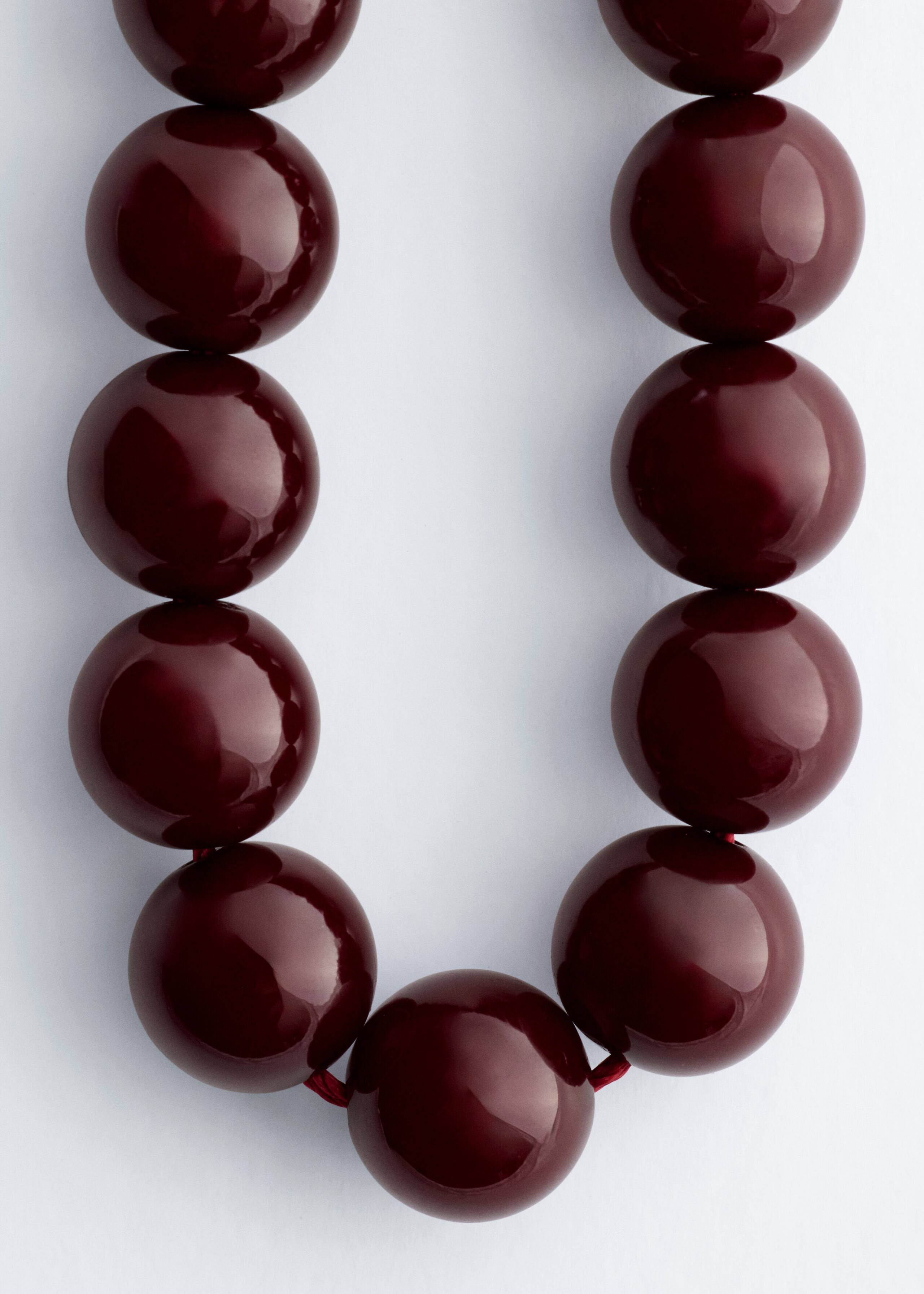 Collana corta con perle di pietra - {{variantName}} - Descrizione dettagliata