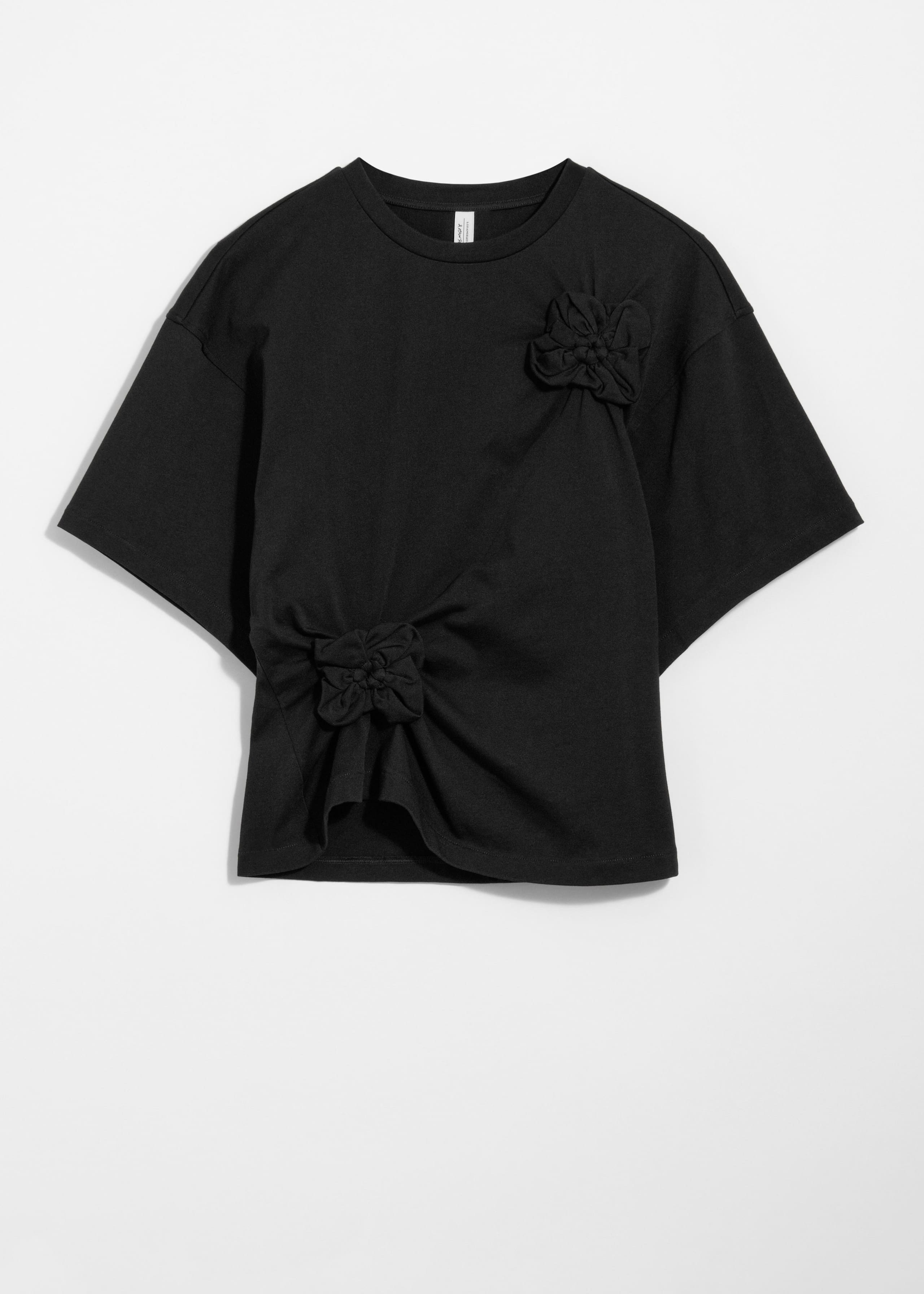 T-Shirt mit Blumenapplikation - Schwarz - Stillleben