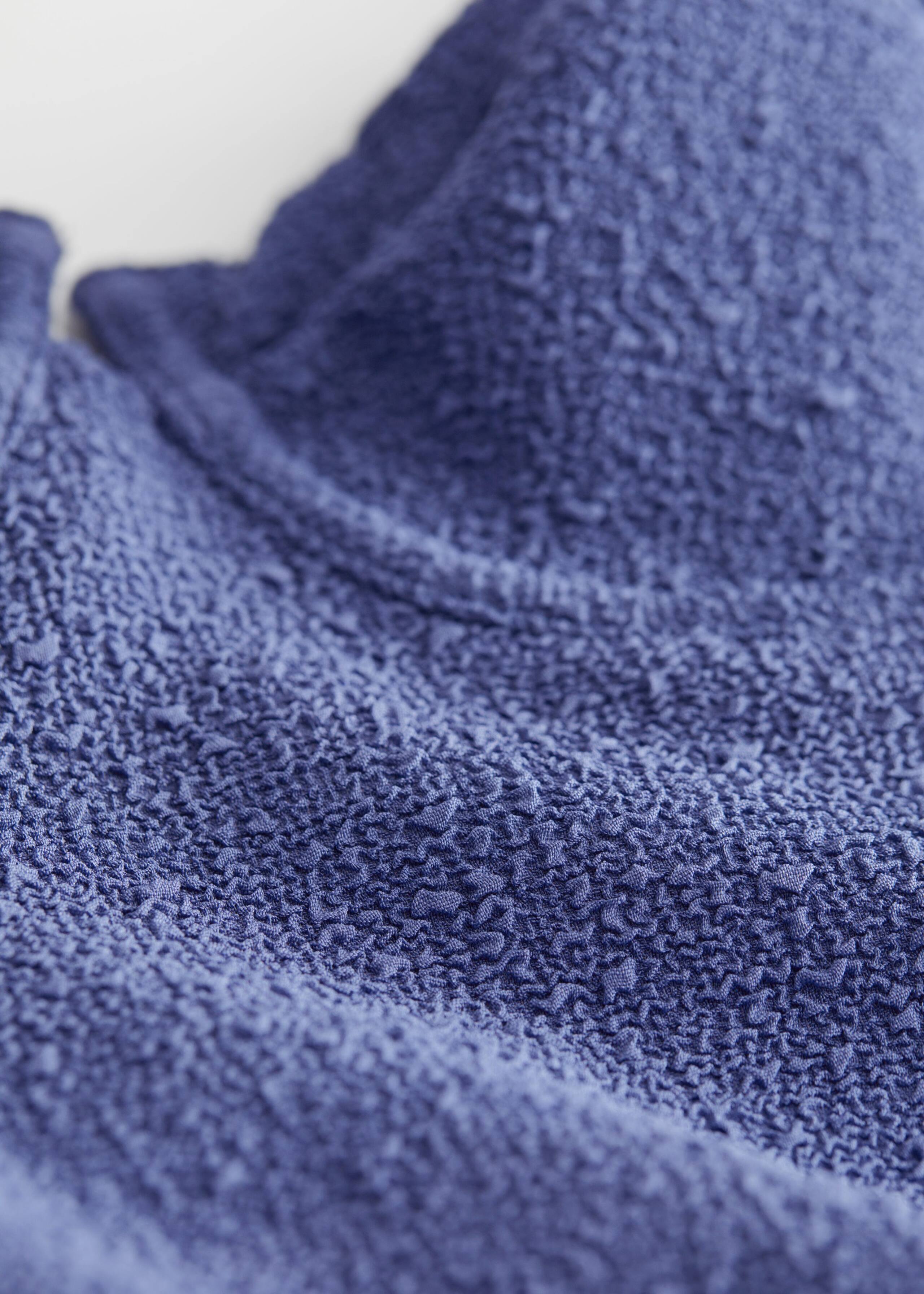 Textured Swimsuit - {{variantName}} - Detalle descriptivo