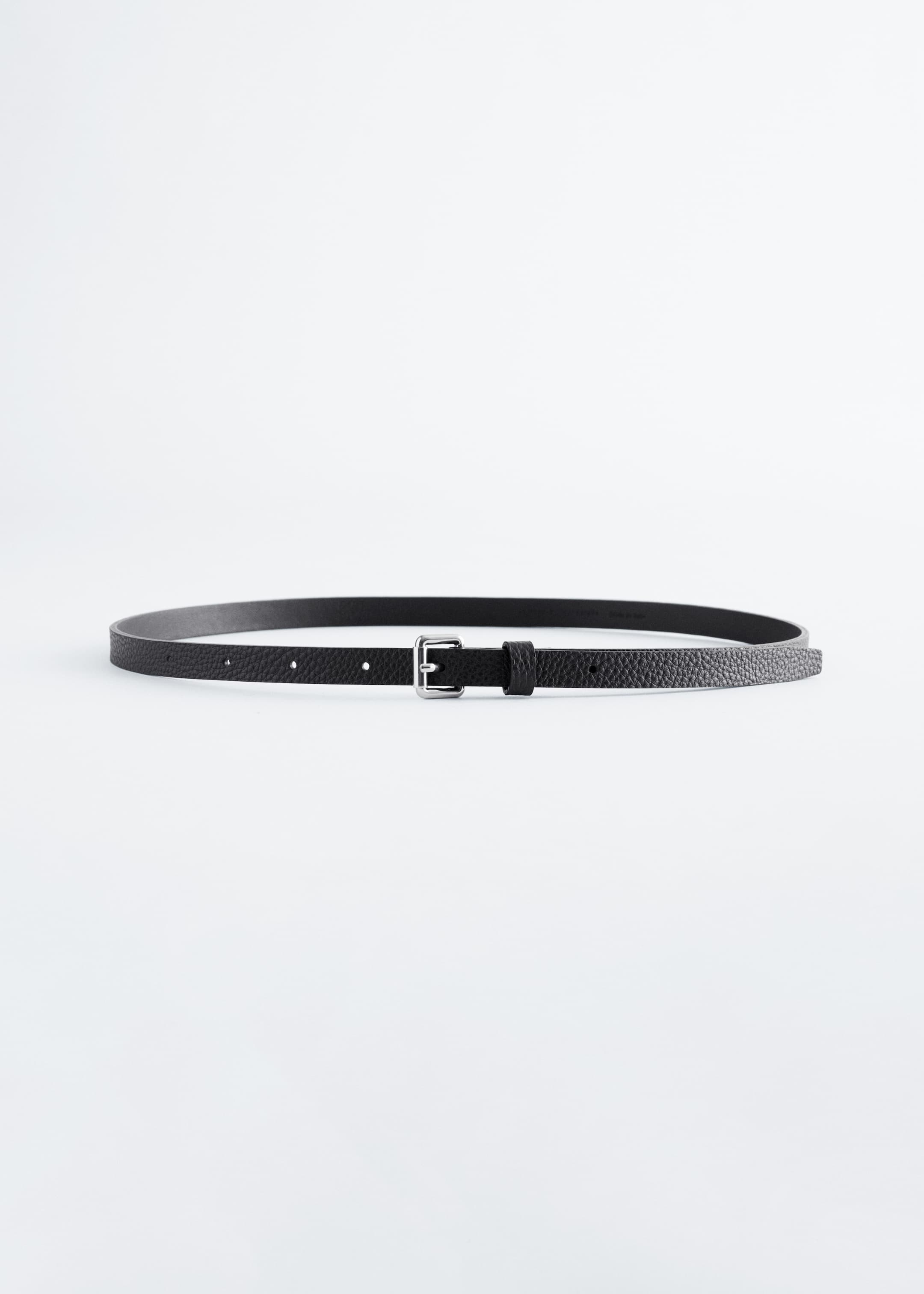 View larger image: A black belt featuring a thin, pebbled texture strap and a silver-toned rectangular buckle. Several punch holes are visible along the strap, with a small keeper next to the buckle.