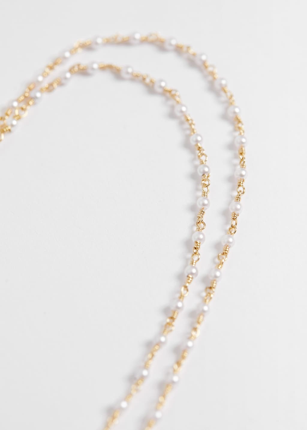 TinyPearlChainNecklace – {{variantName}} – Szczegół