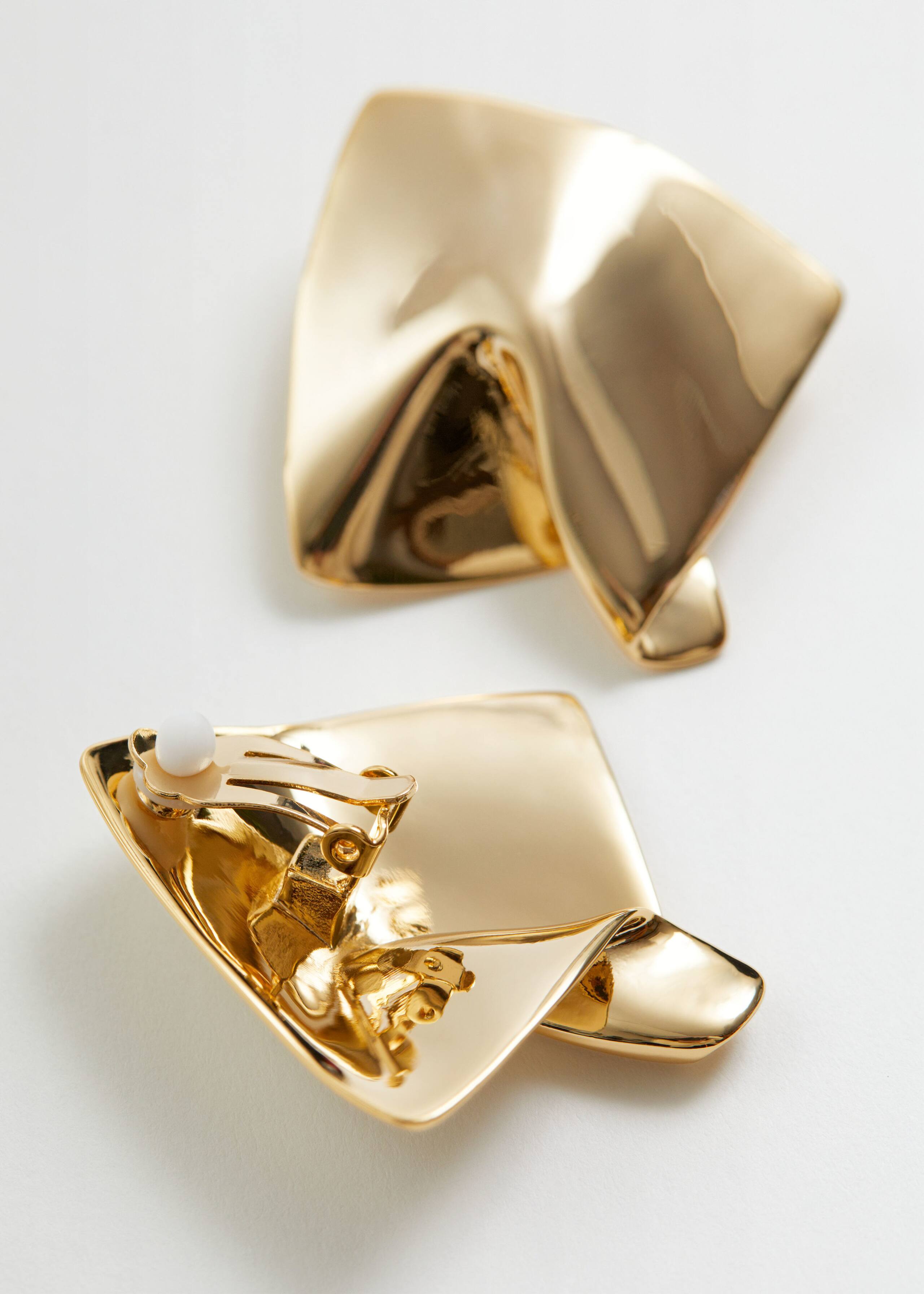 Sculptural Clip Earrings - {{variantName}} - Descrizione dettagliata