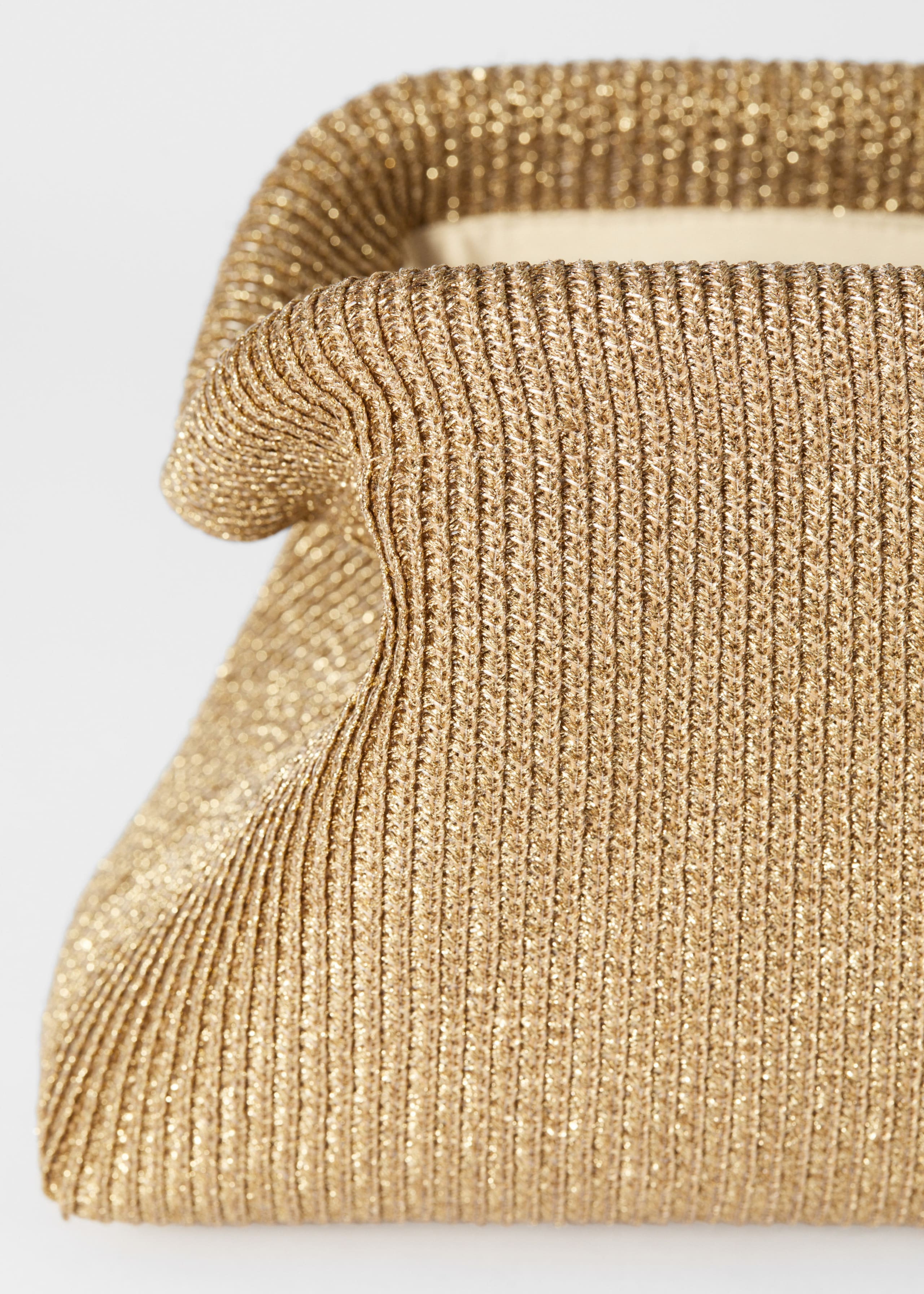 Clutch dorata - {{variantName}} - Descrizione dettagliata