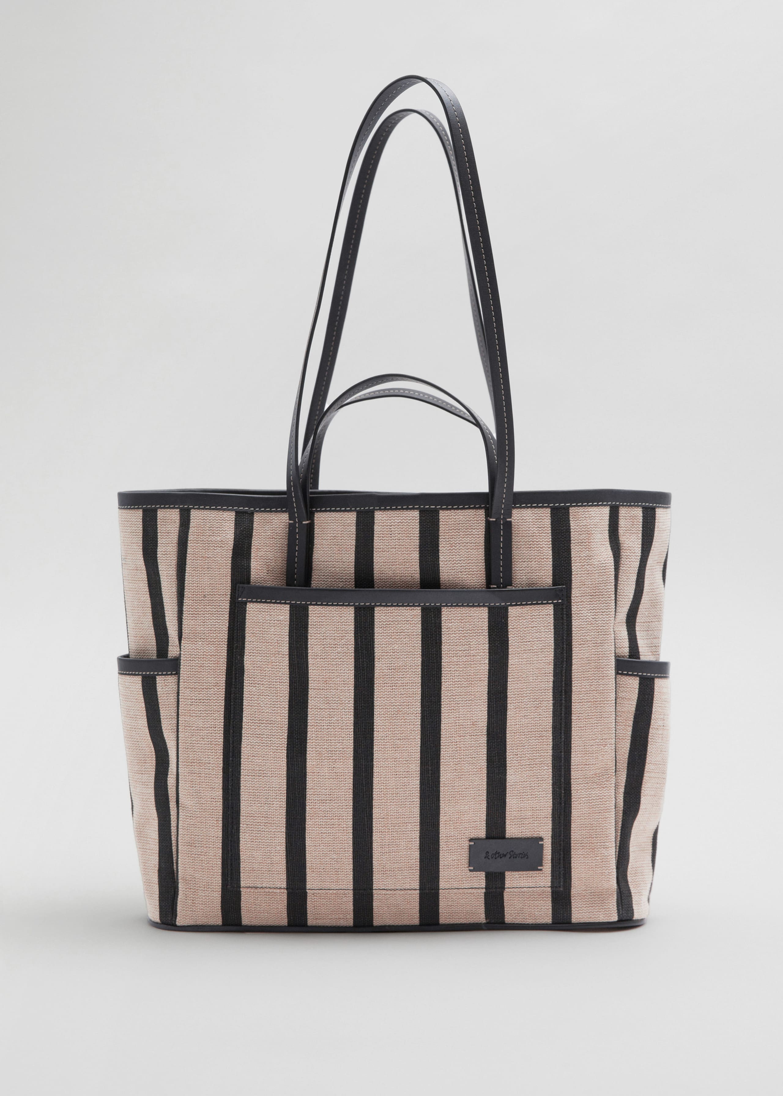 Große Canvas-Tragetasche mit Lederbesatz - Beige/Schwarz - Stillleben