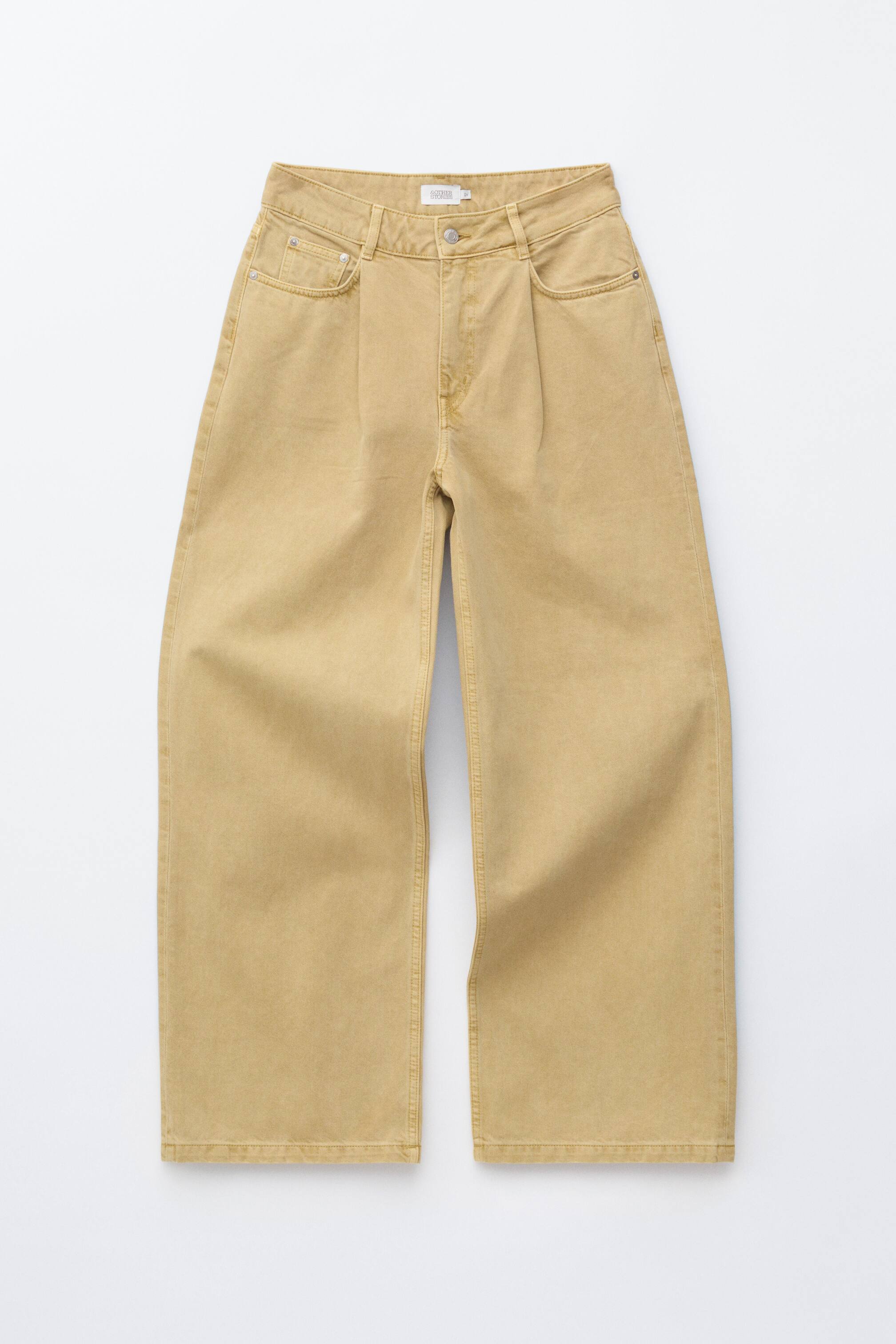 Zobrazit větší obrázek: Široké kalhoty v béžové barvě mají vysoký pas s plisovanou přední částí, kapsy na bocích včetně malé kapsičky na mince na pravé straně a poutka na opasek kolem pasu.