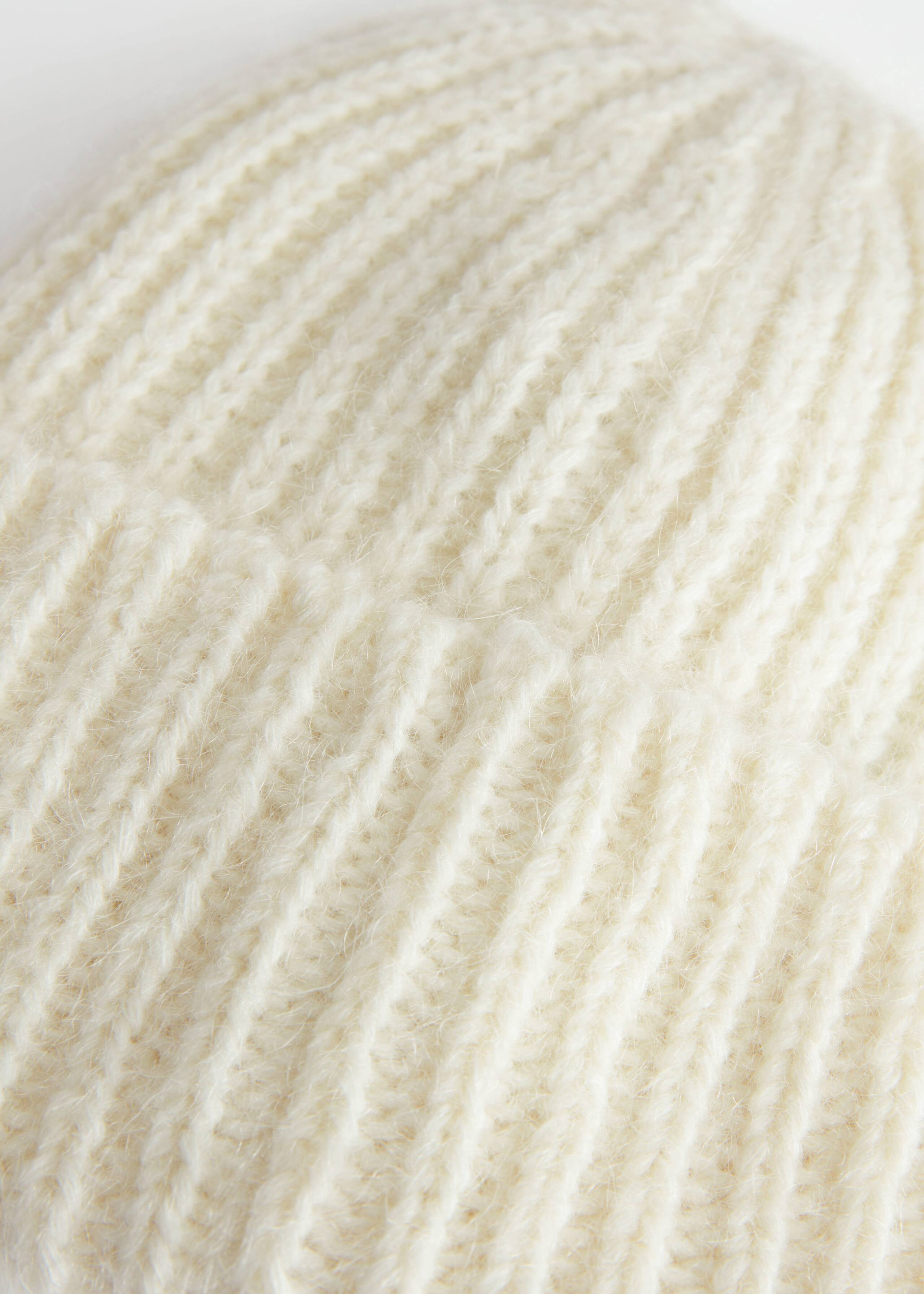 Fuzzy Knit Beanie - {{variantName}} - Descriptive Detail