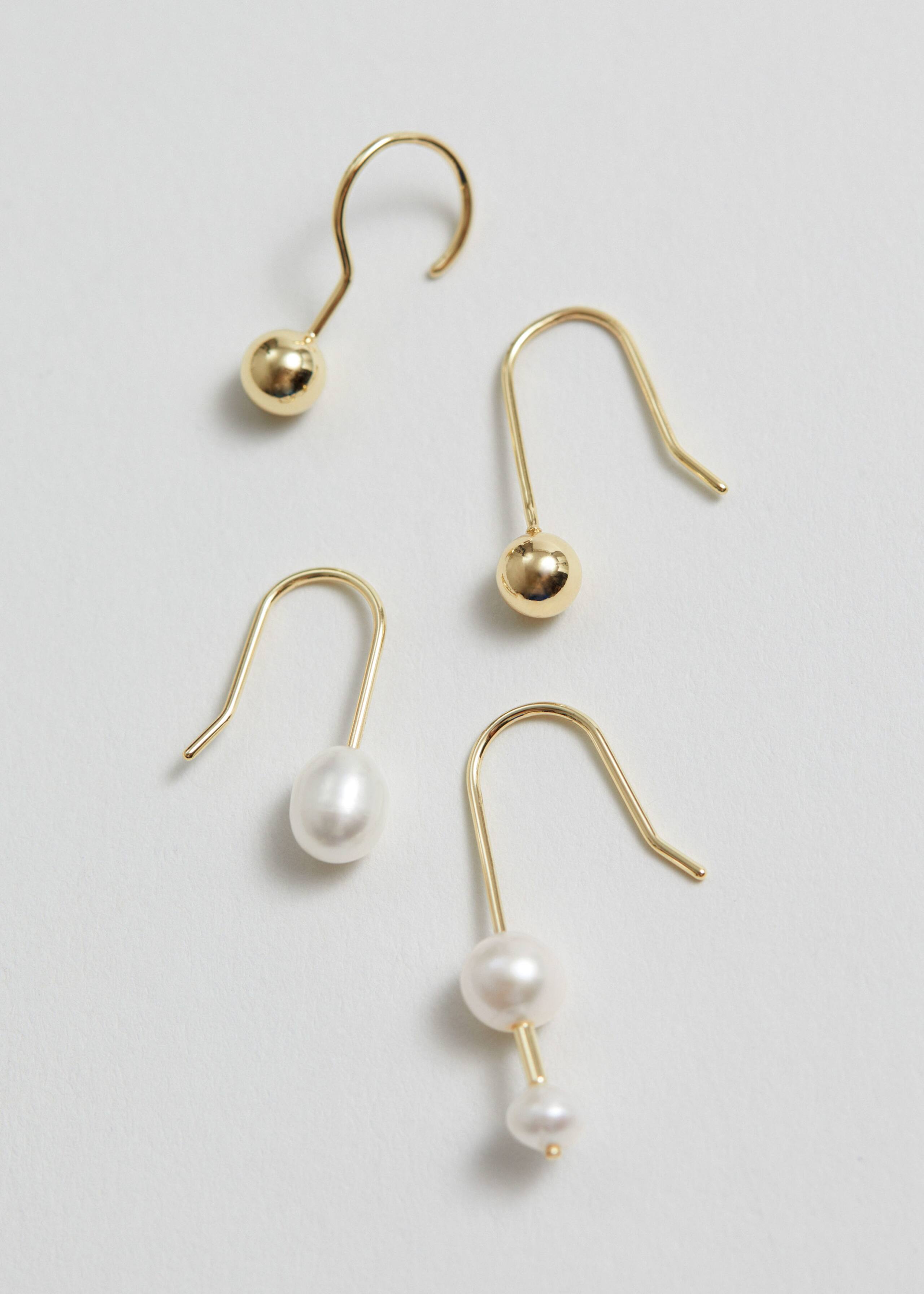 Set mit verschiedenen Ohrringen - Gold - Stillleben