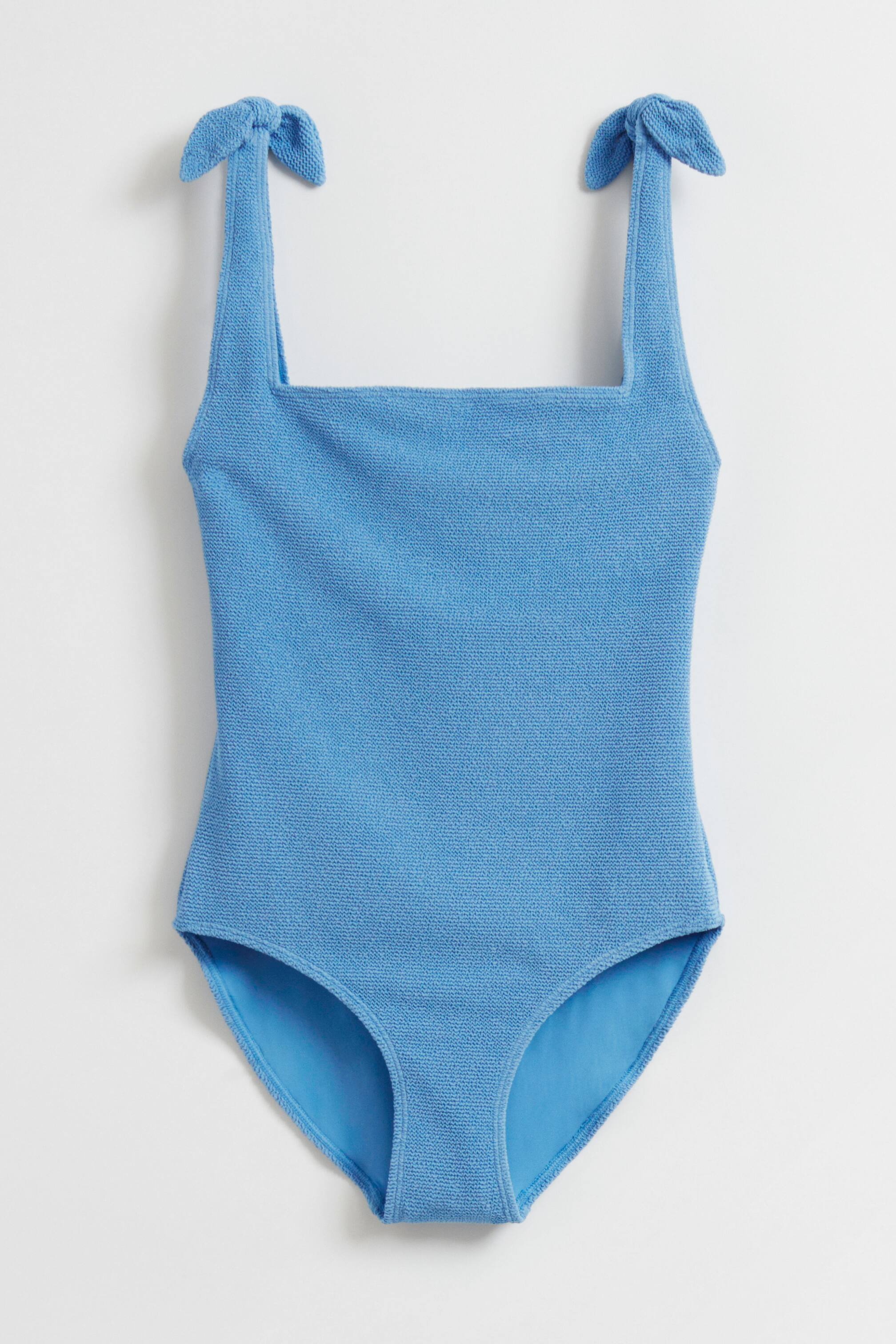 Ver imagen más grande: Traje de baño con lazo texturizado - Dusty blue - MUJER | H&M ES 1