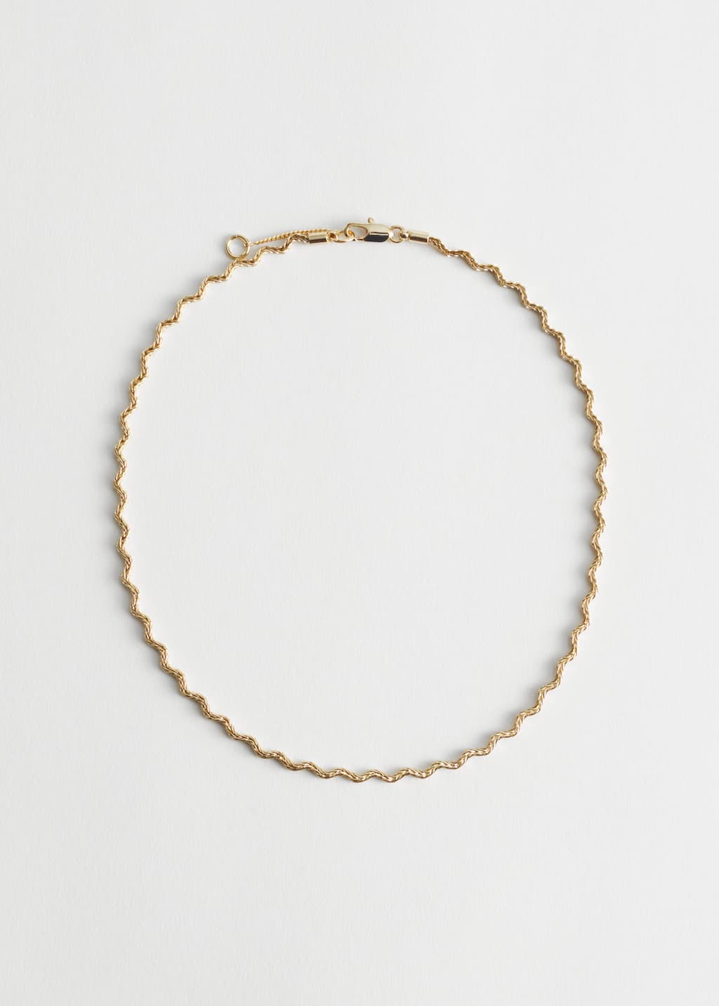 Collana rolò ondulata - Oro - Natura morta