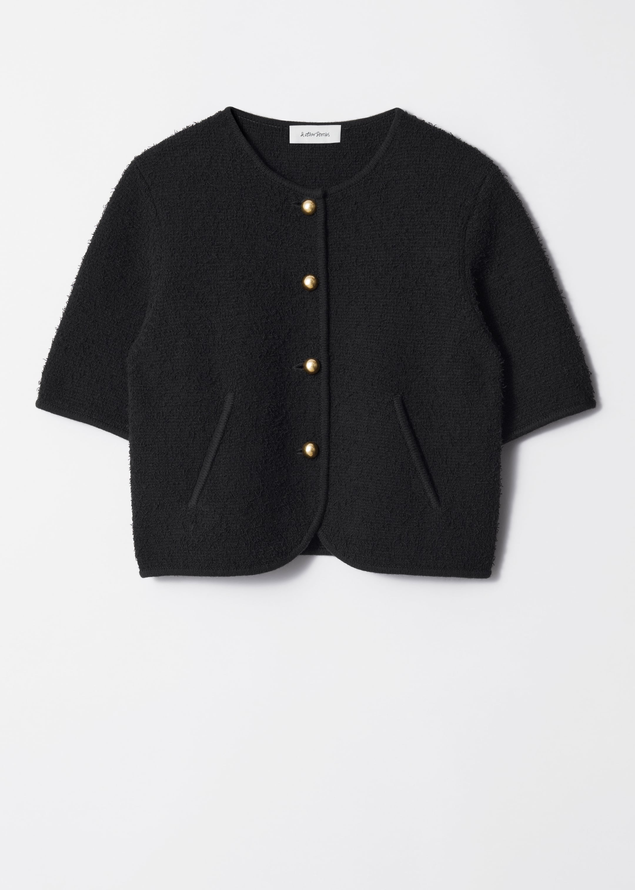 Visa större bild: Texturstickad cardigan med kort ärm - Svart - DAM | H&M SE 1