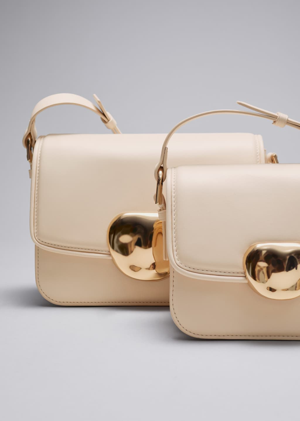 Sculptural Buckle Leather Bag - {{variantName}} - Descriptive Detail