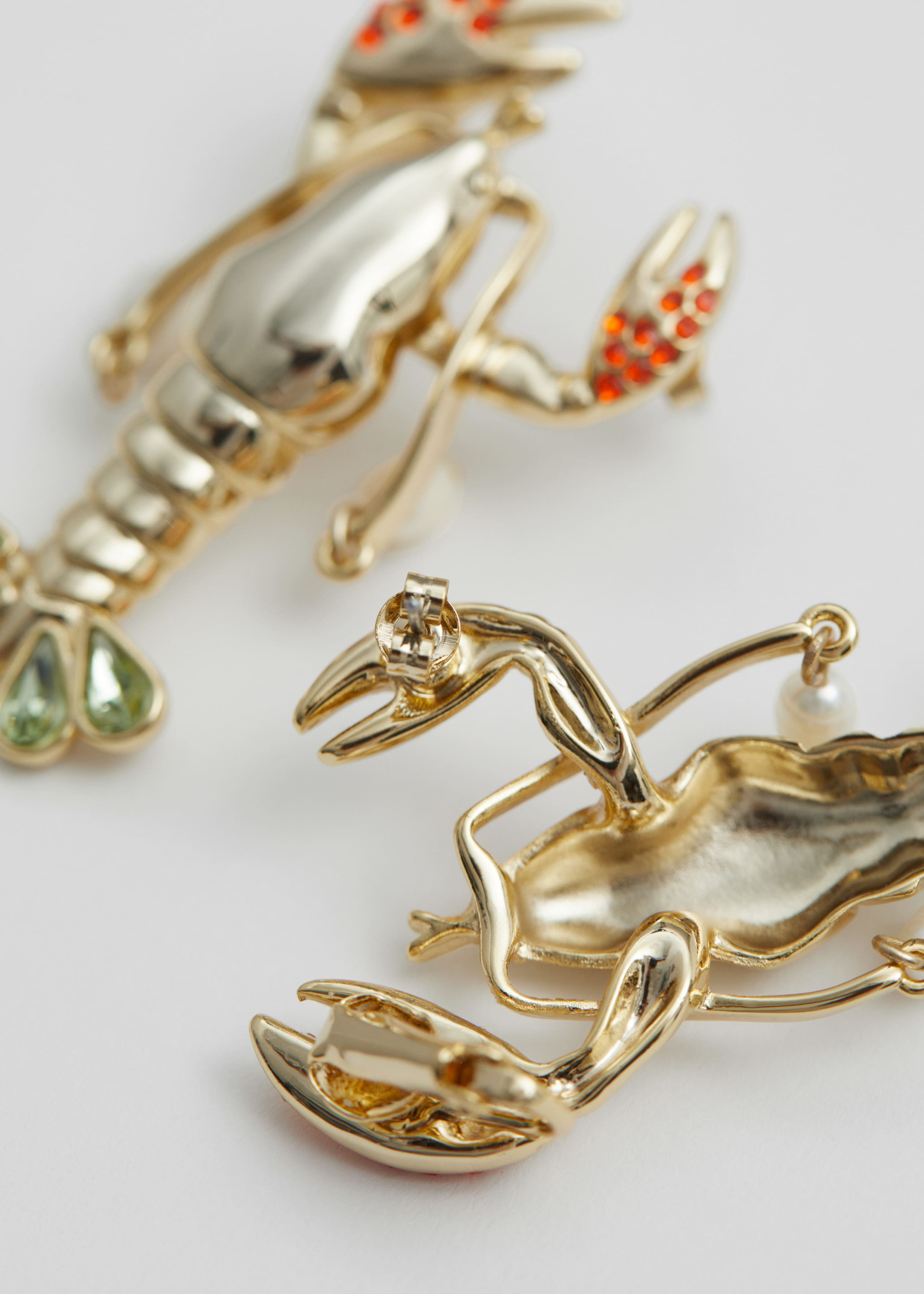 Boucles d’oreilles homard brillantes - {{variantName}} - Descriptive Detail