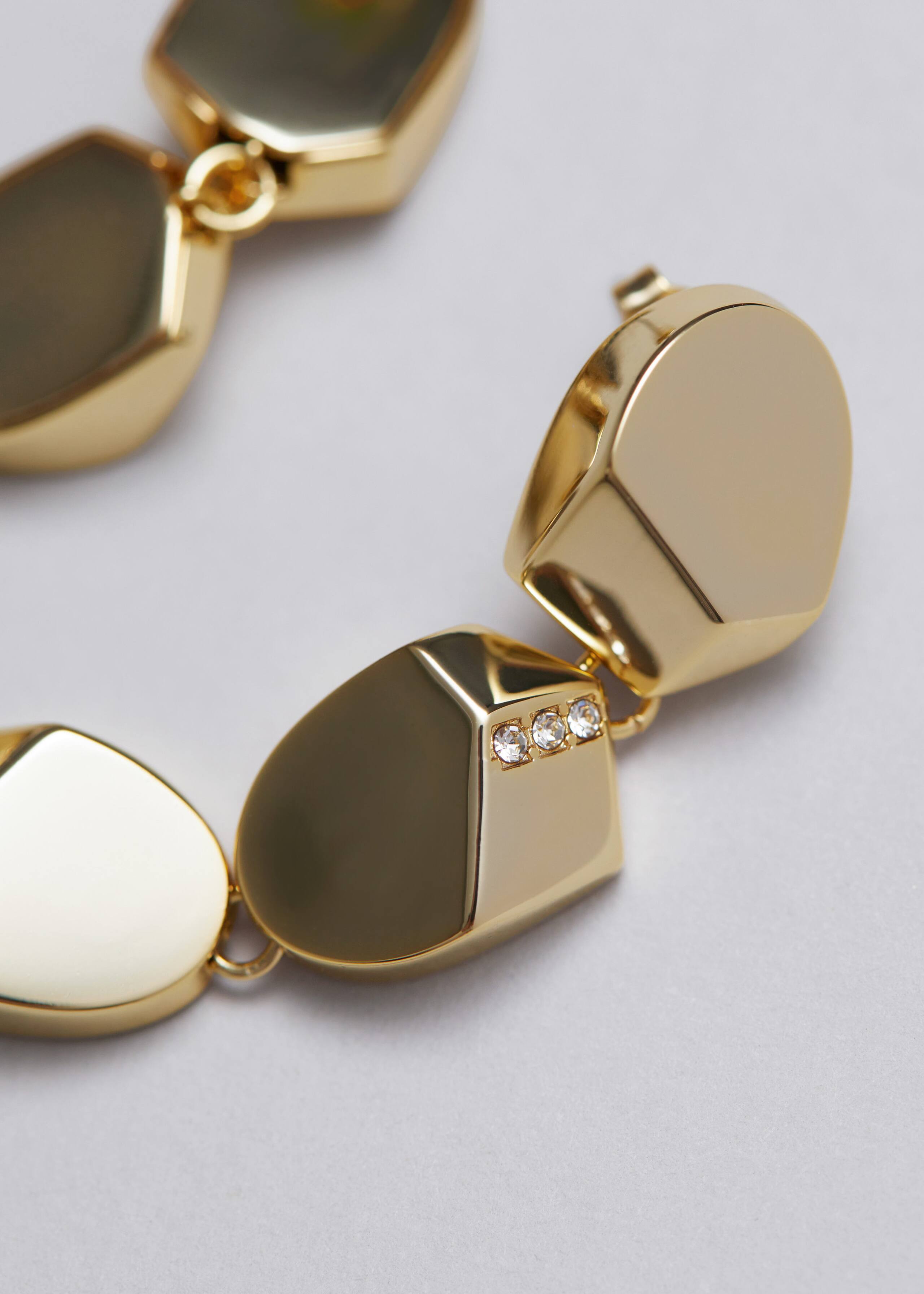 Orecchini pendenti scultorei - {{variantName}} - Descrizione dettagliata