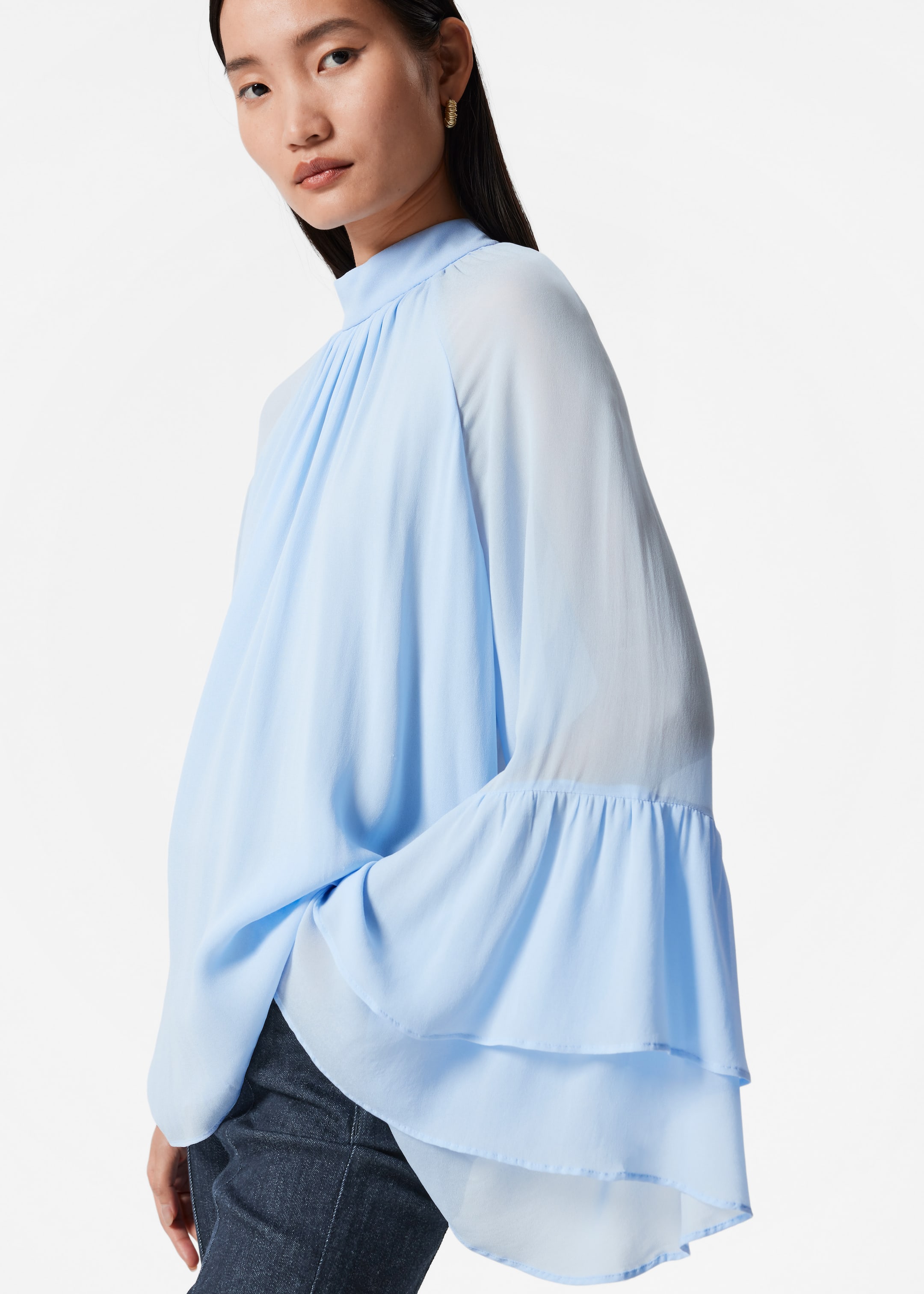 Visa större bild: Blus med ståkrage och volanger - Ljusblå - DAM | H&M SE 1