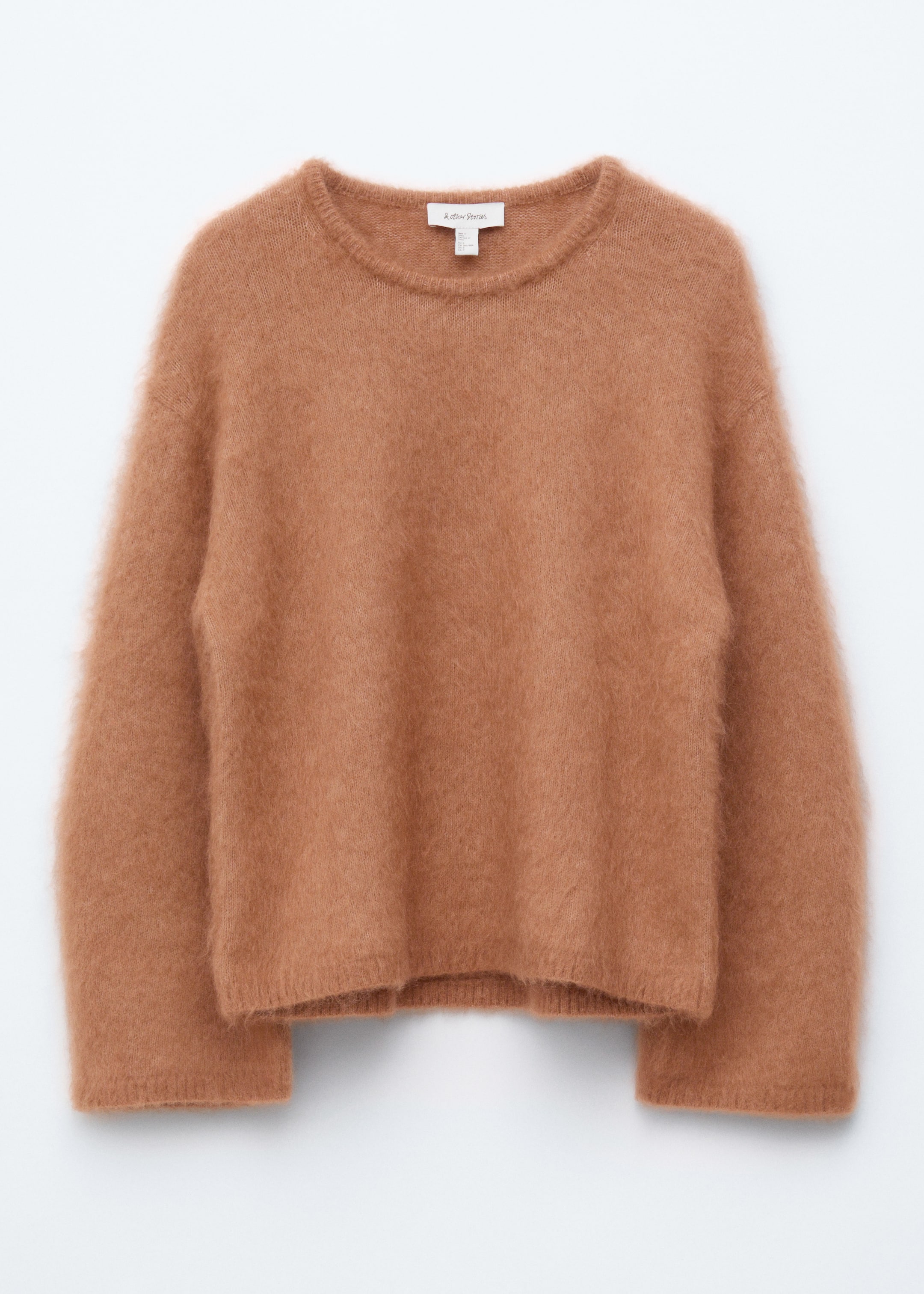 View larger image: A brown sweater is presented from the front, displaying a soft, brushed texture. It is designed with a loose silhouette, voluminous long sleeves, and ribbed cuffs, neckline, and hem.
