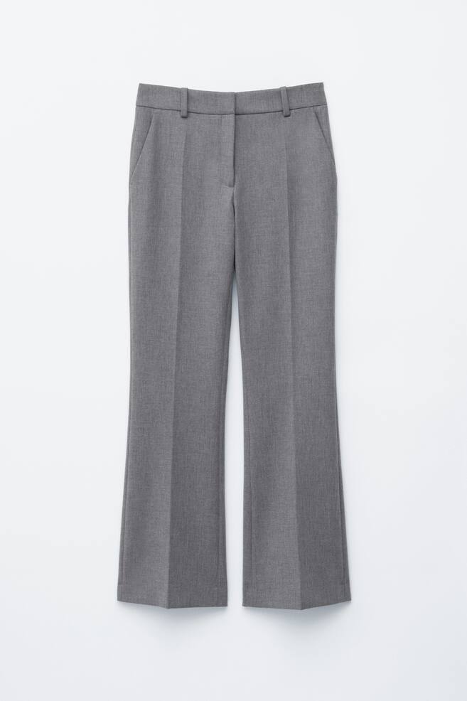 Grey trousers are presented as FRONT, featuring straight-cut legs with a subtle flare at the hem, sharp press creases, and belt loops. A zip fly with a hook-and-bar fastening and angled side pockets are visible. - 1