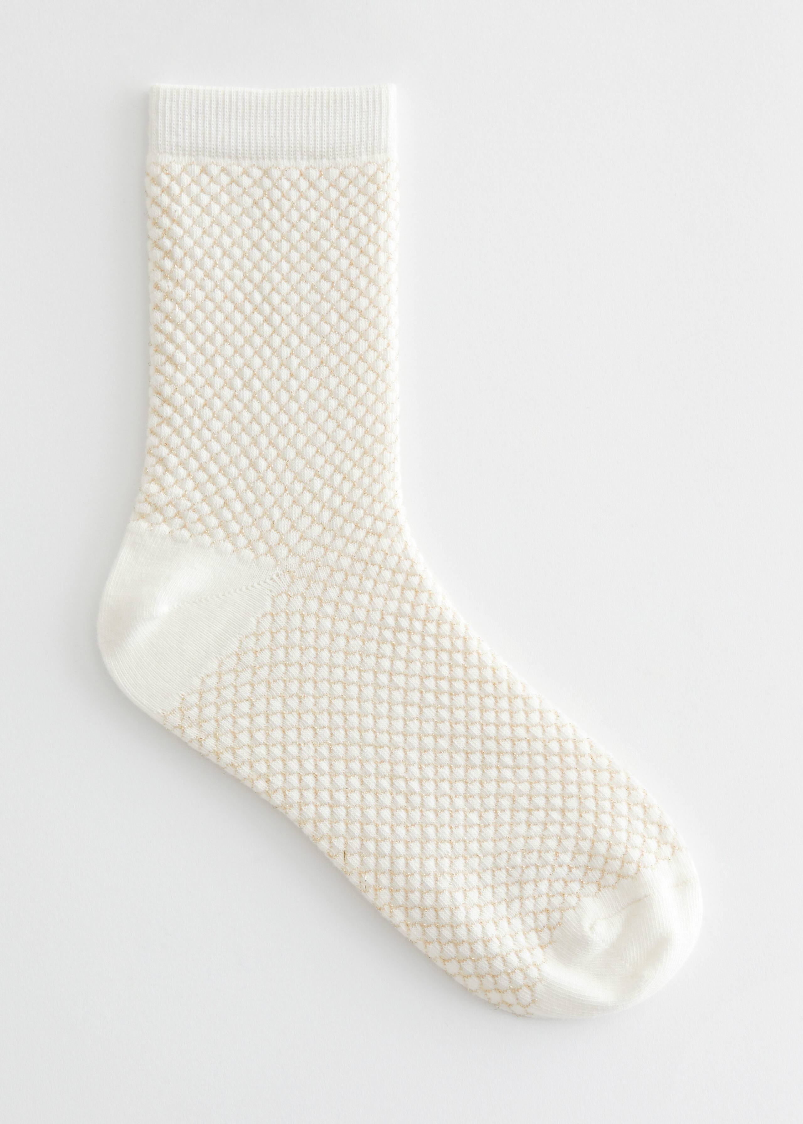 Strumpor i lurex – Mörkgrön – stilleben