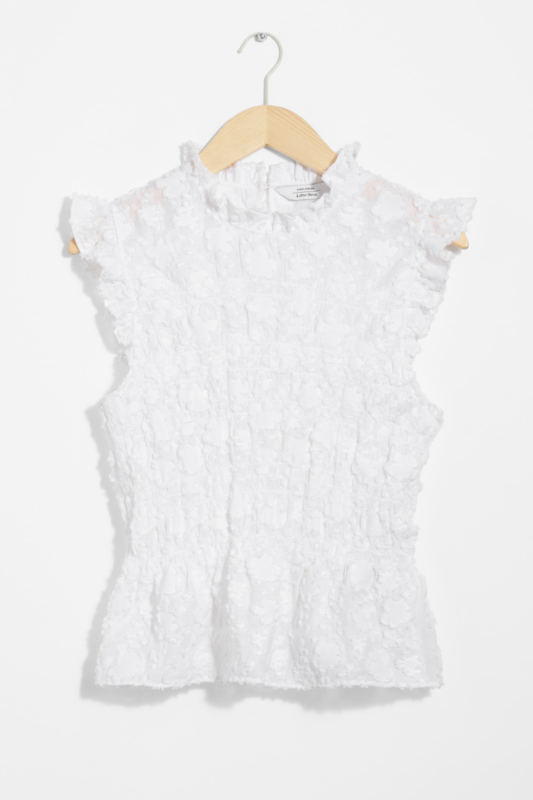 Näytä suurempi kuva: Smokkirypytetty peplum-toppi - Valkoinen - NAISET | H&M FI 1