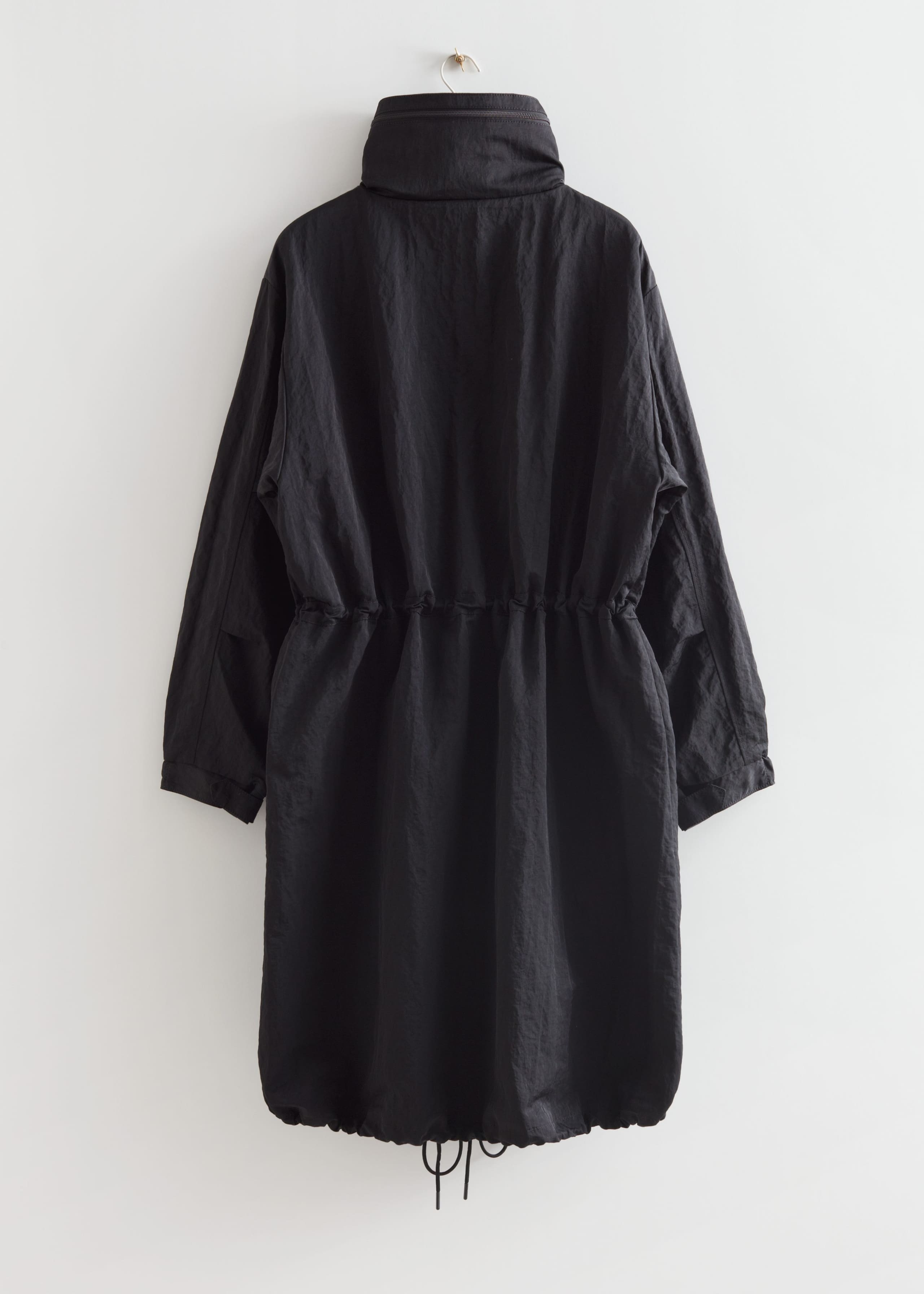 Parkas med dragsko – Svart – stilleben