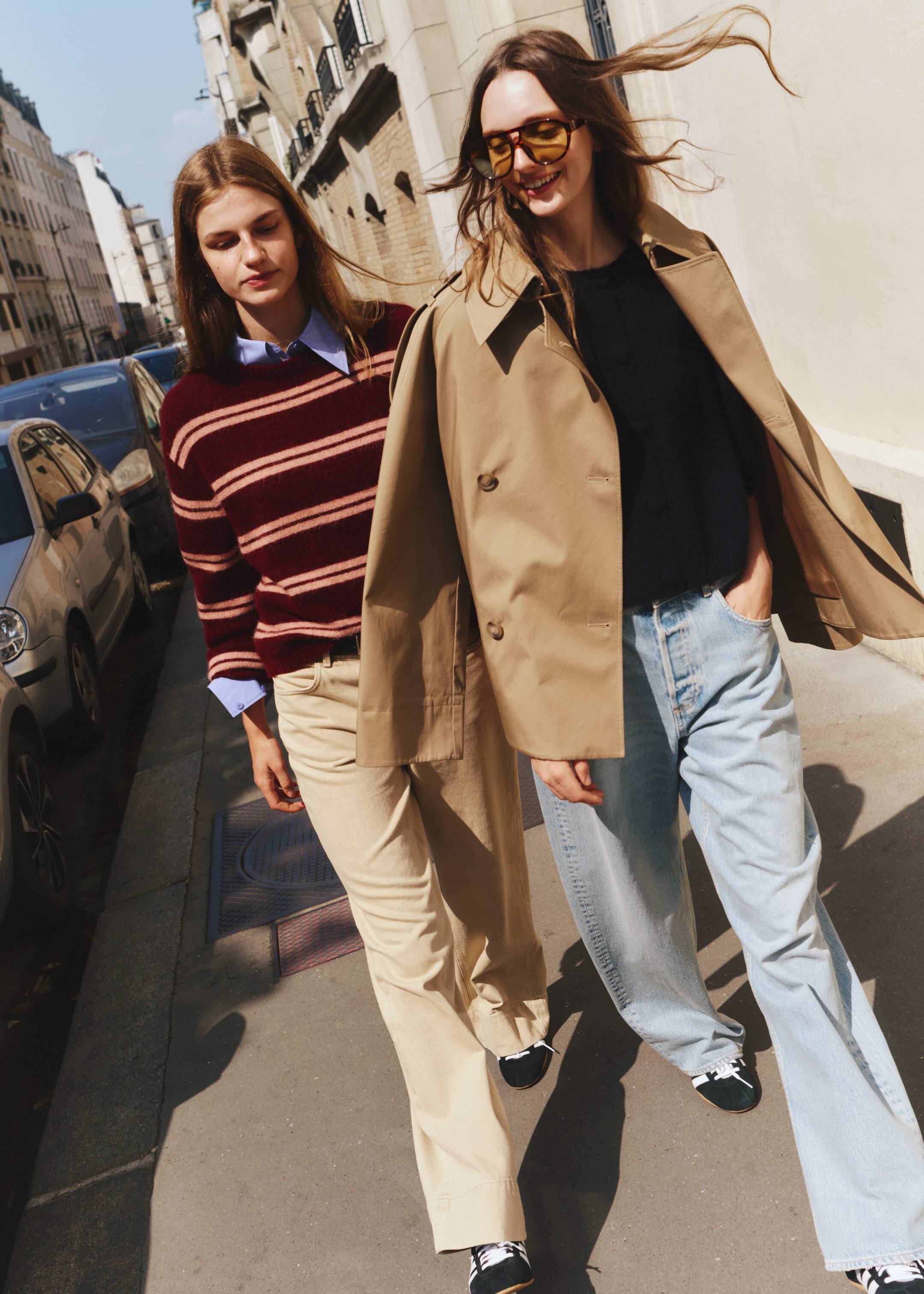 View larger image: A burgundy sweater with light horizontal stripes is being worn by a person, angled slightly to the right. It is featuring a crew neck, ribbed cuffs, and hem, and is visibly layered over a light blue collared shirt.