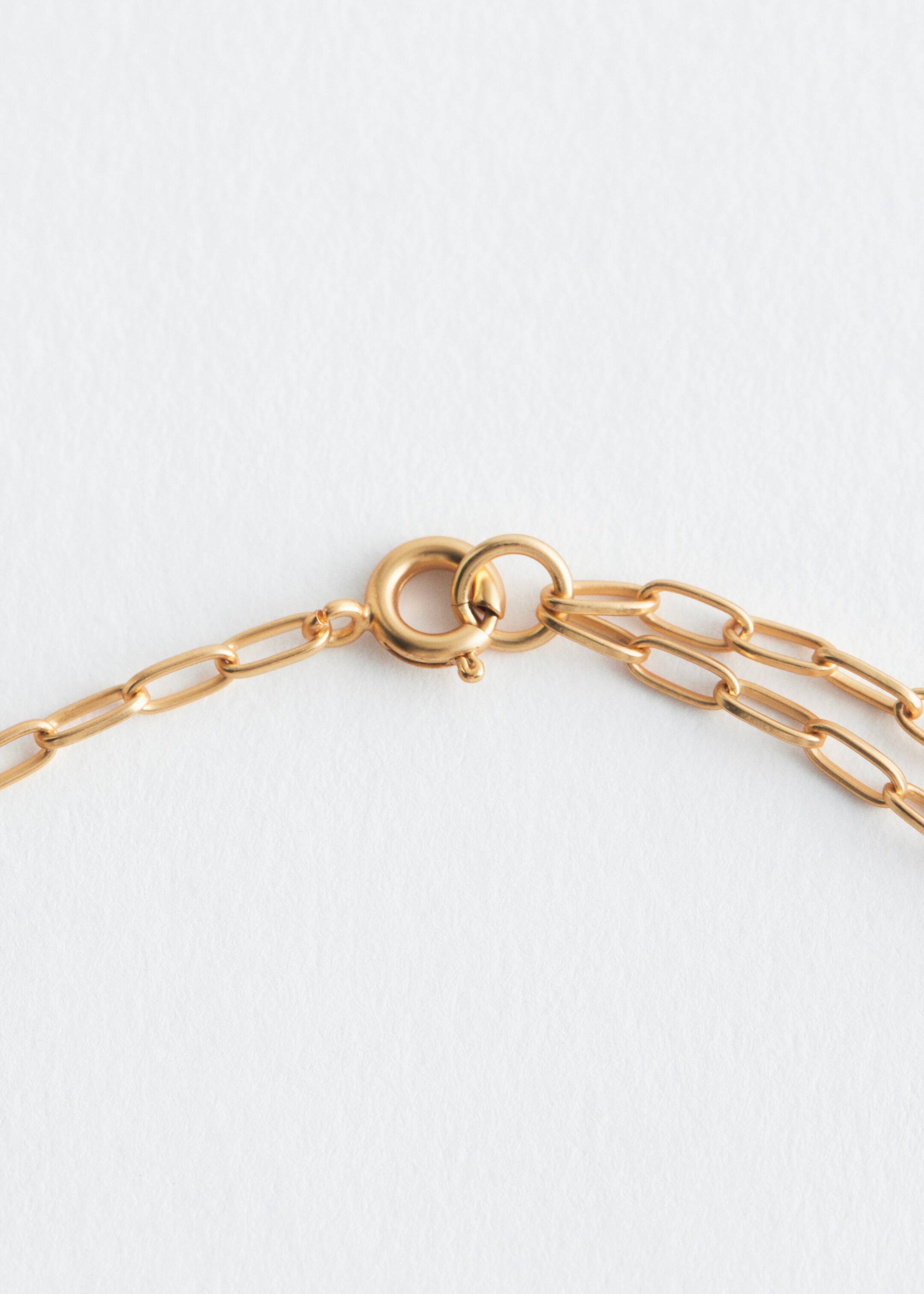 View larger image: The necklace's back is featuring a polished brass spring ring clasp, which is connecting two segments of a paperclip chain.