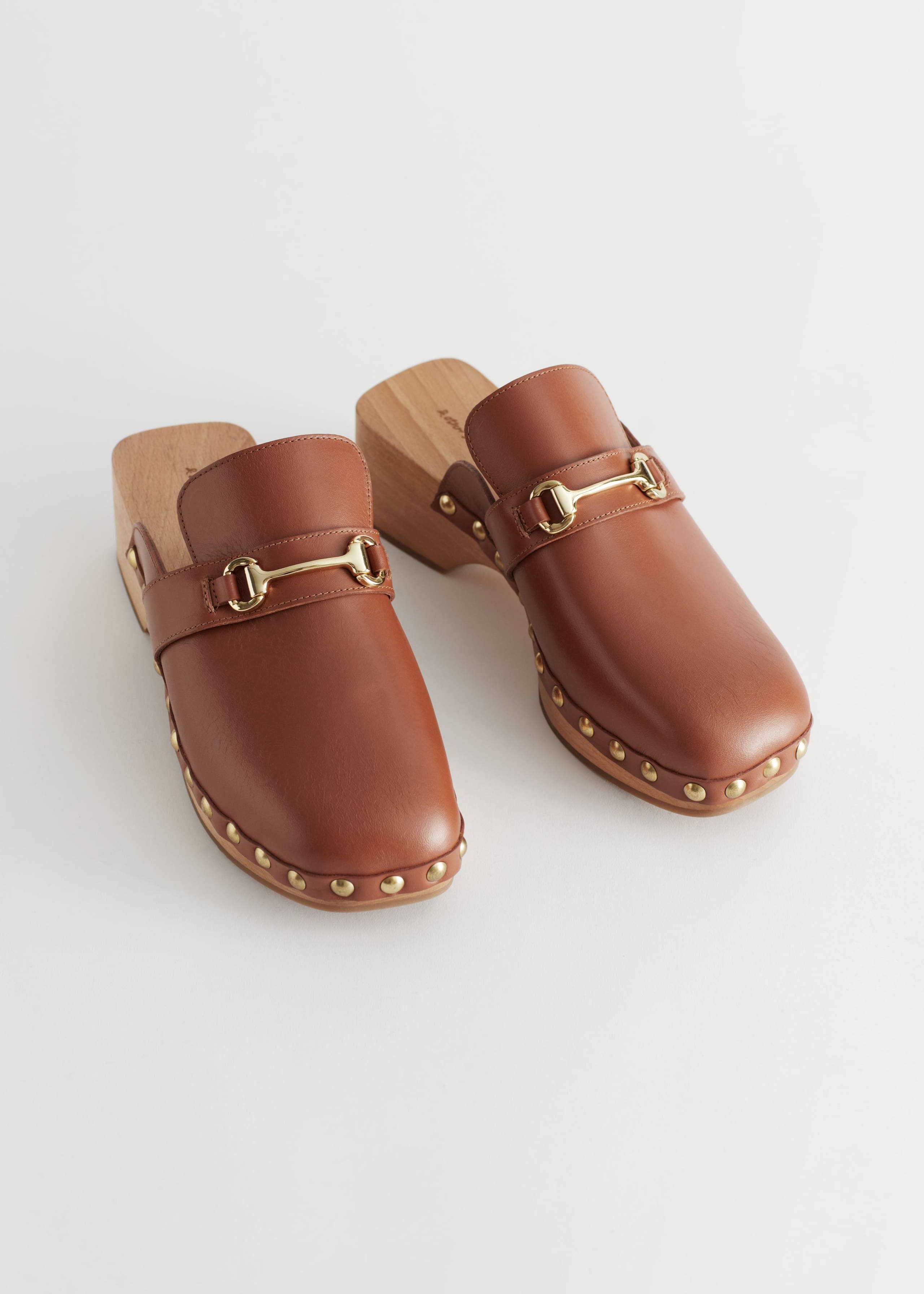 Image of StuddedLeatherWoodenDecoClogs