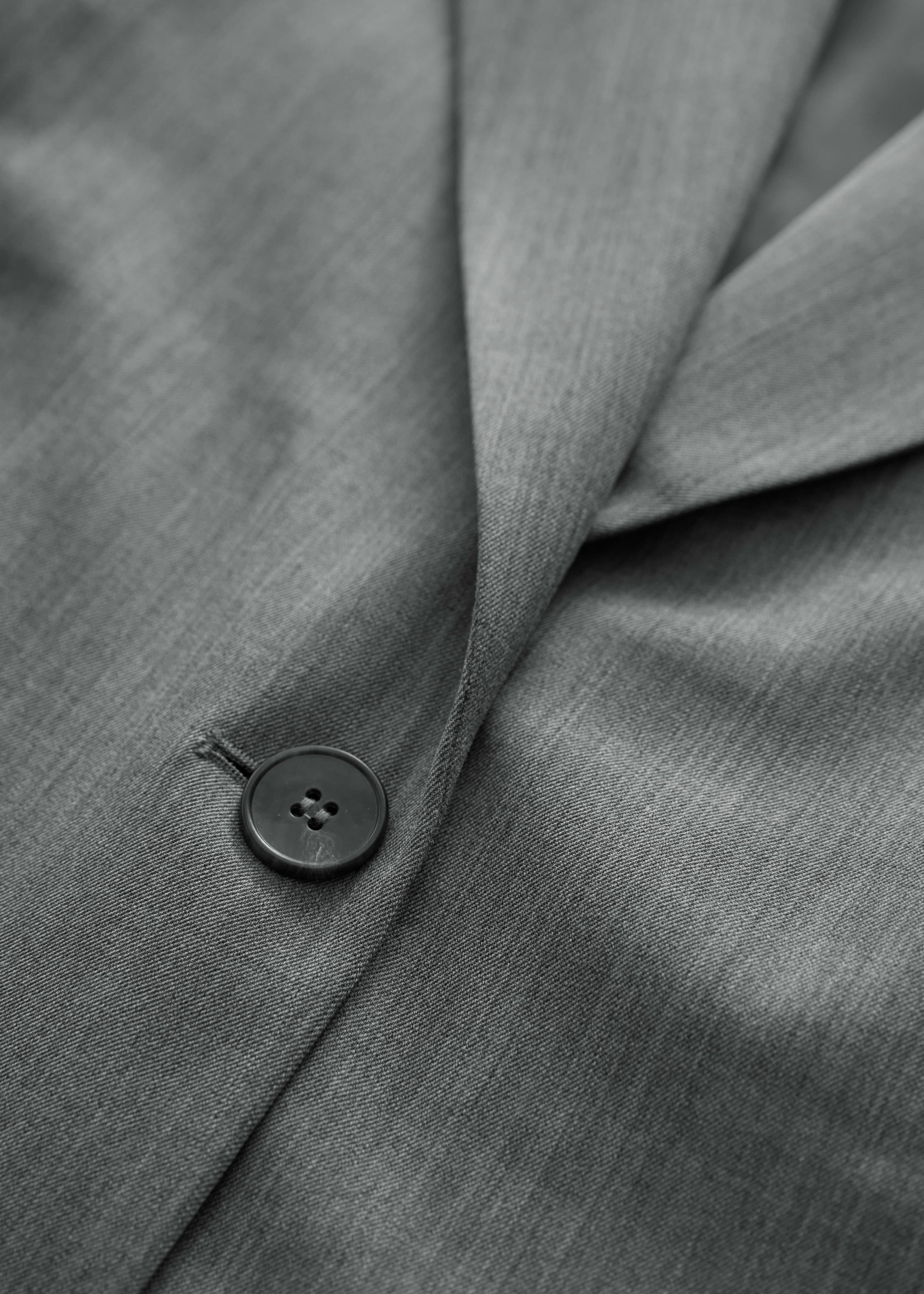 Einreihiger Blazer - {{variantName}} - Beschreibendes Detail
