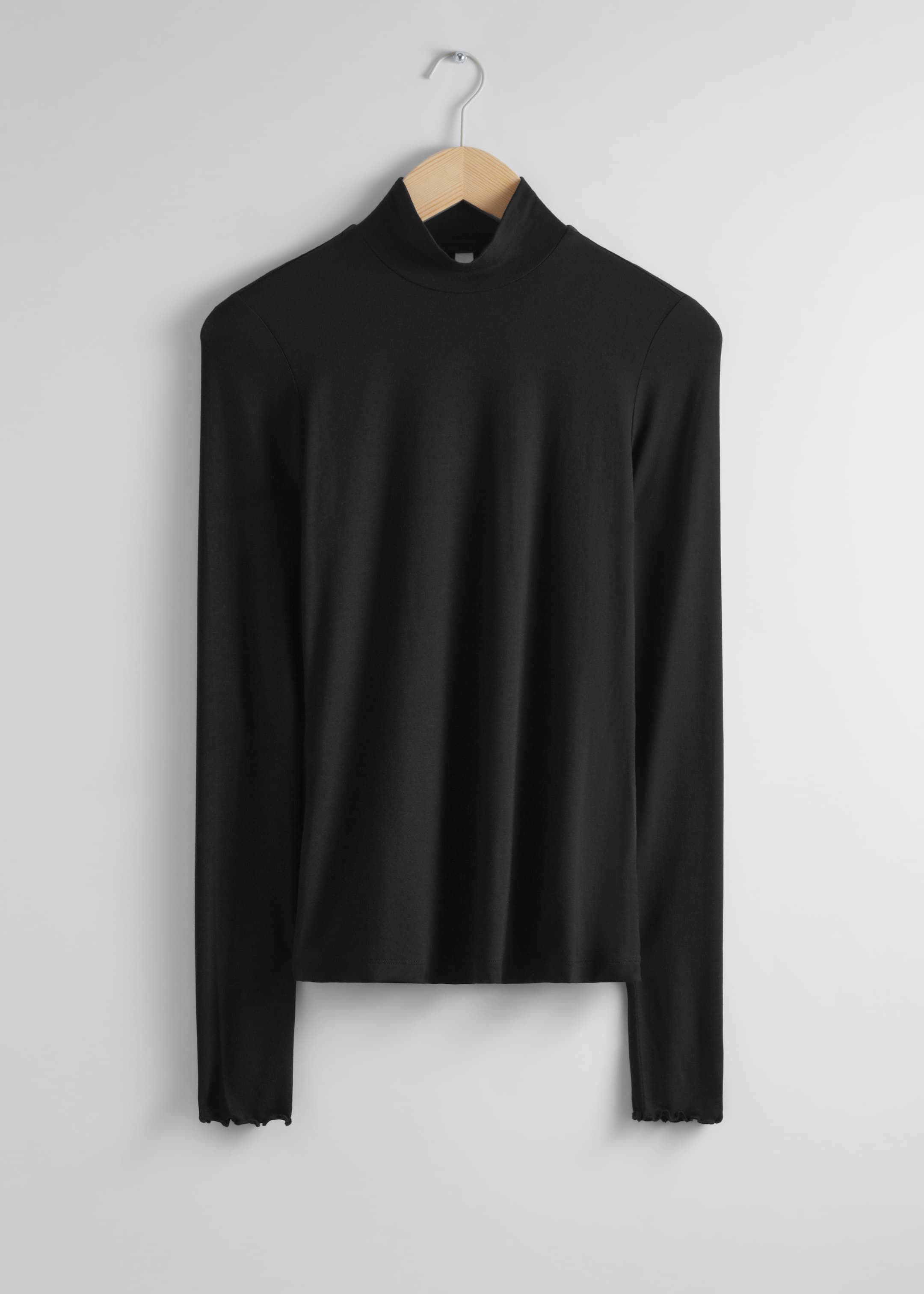 Se større billede: Mockneck-top med flæsede manchetter - Sort - DAME | H&M DK 1