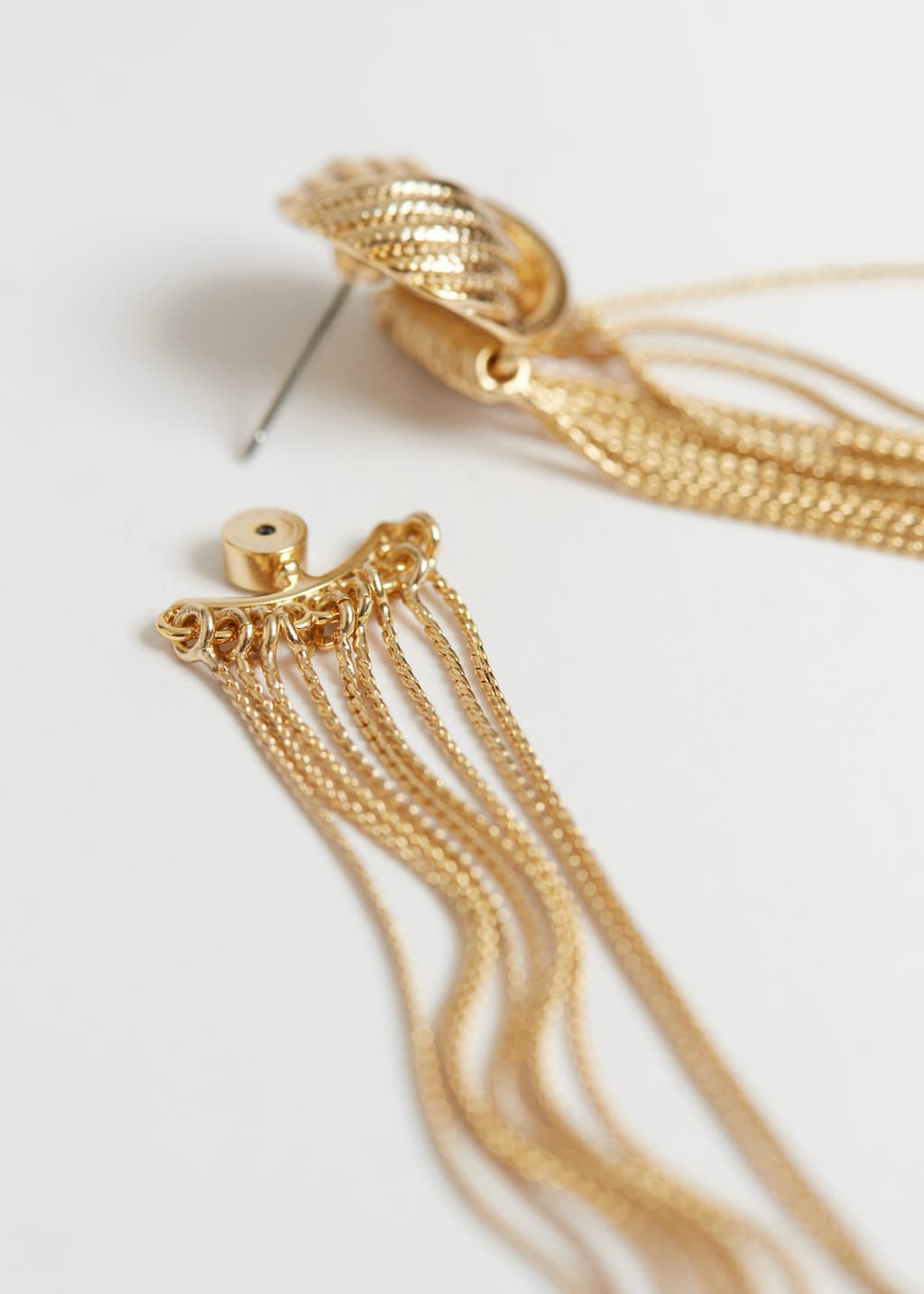 Boucles d'oreilles à pompons noués - {{variantName}} - Descriptive Detail