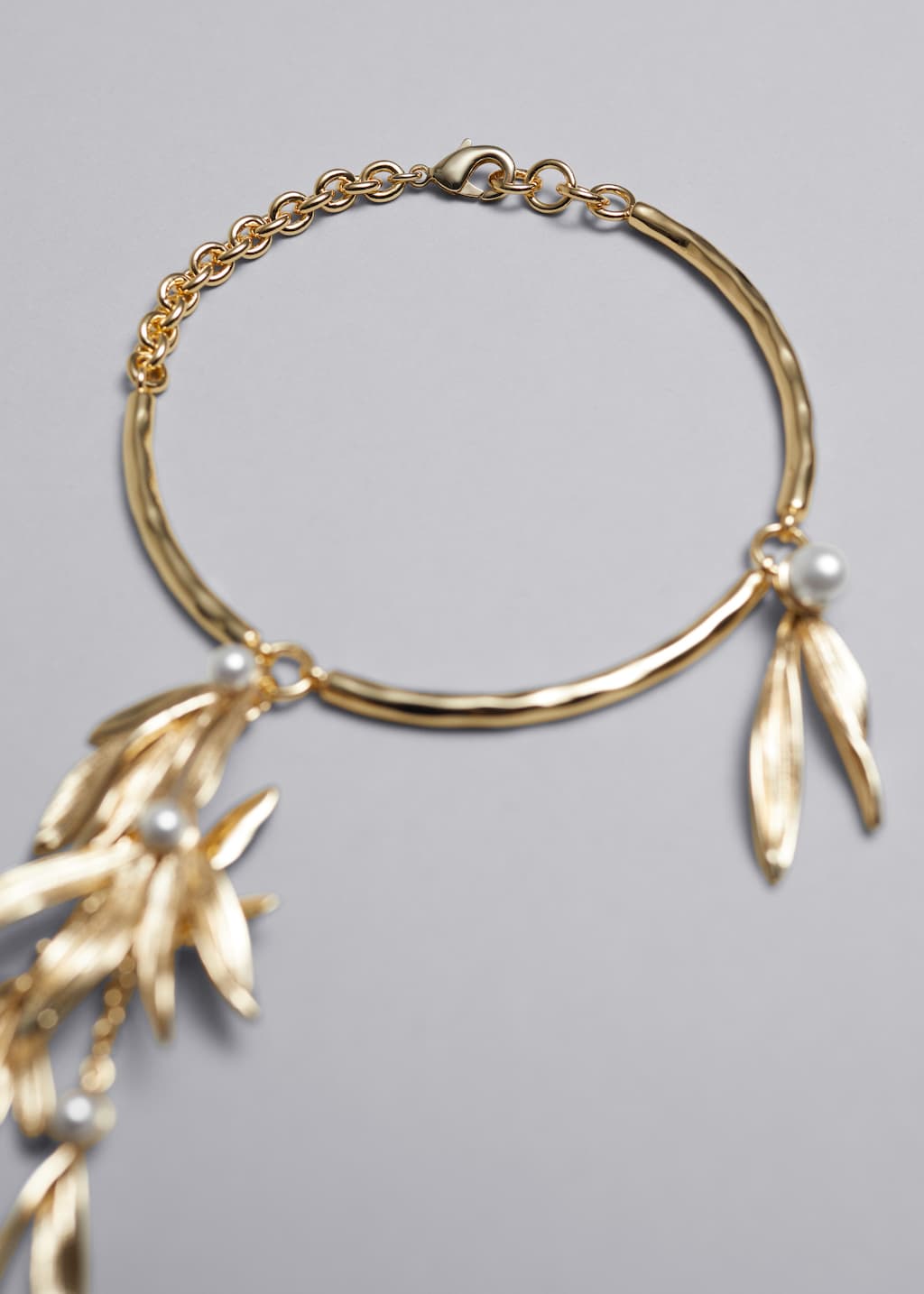 Bracciale con decorazioni - {{variantName}} - Descrizione dettagliata