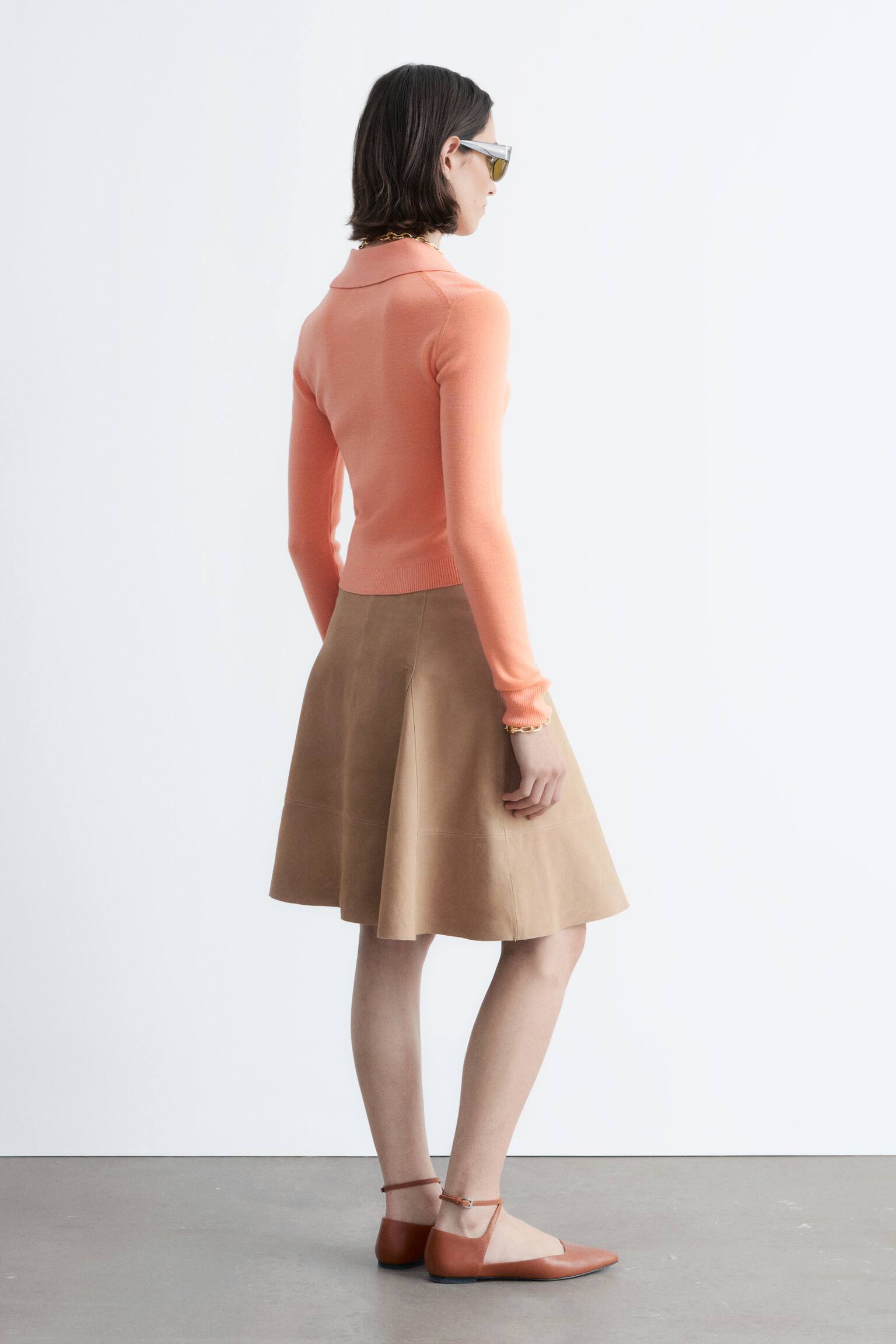 Rippstrick-Poloshirt aus Merinowolle - Pfirsich/Grau meliert/Dunkelbraun - 10