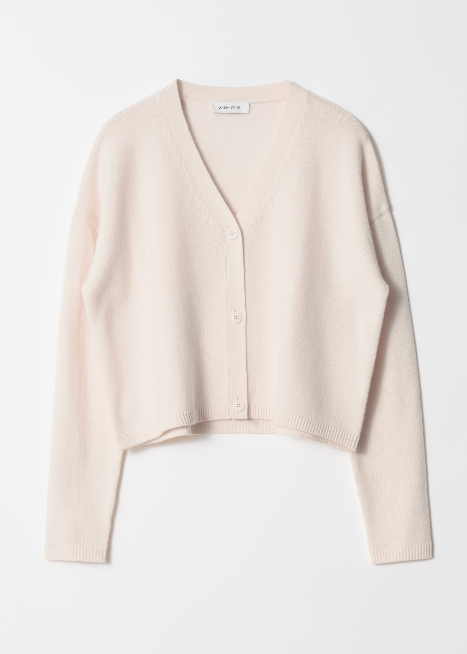 Lockere Strickjacke aus Wolle - Creme/Schwarz