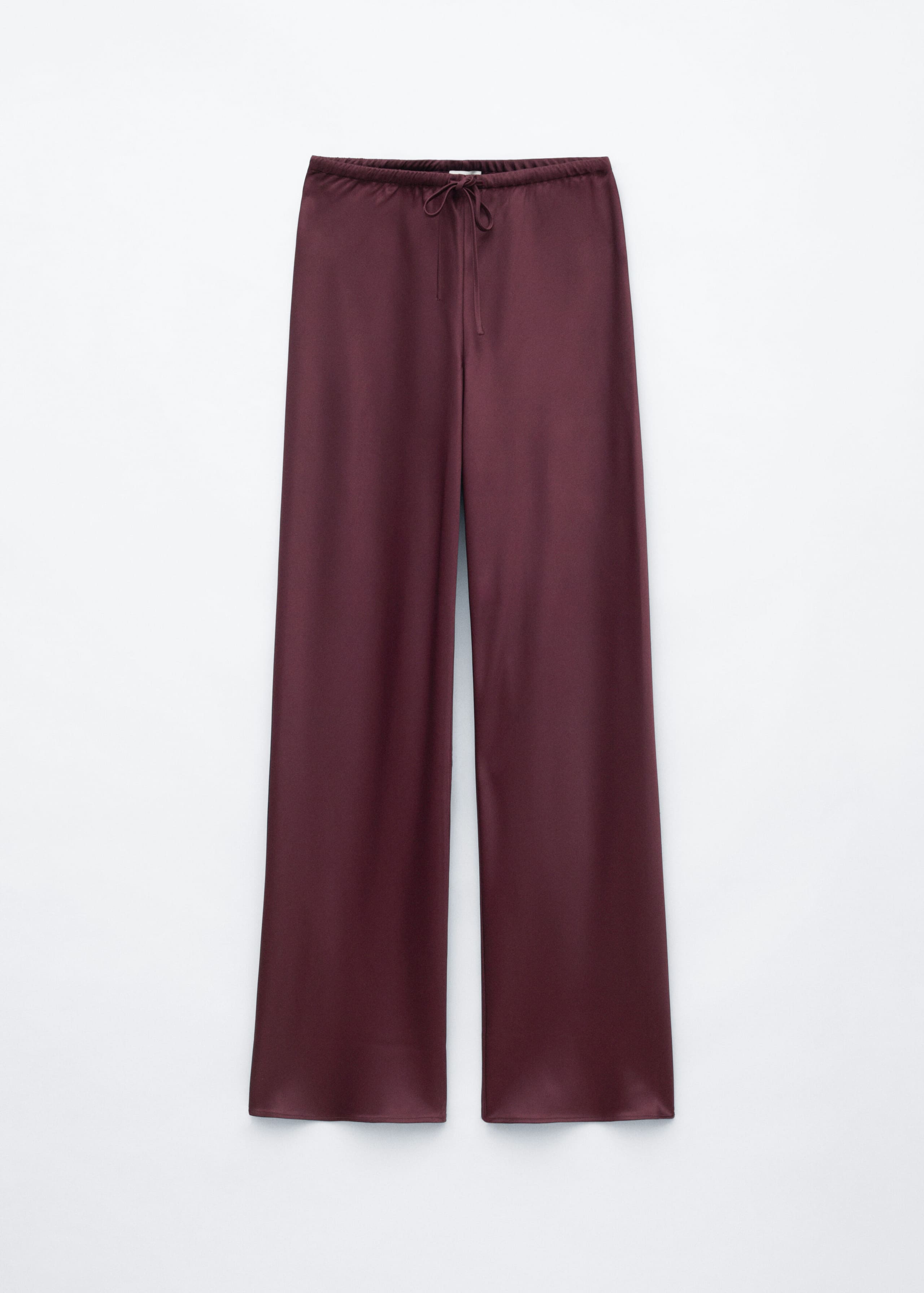 These burgundy satin pants are shown from the front, featuring a relaxed, wide-leg silhouette and an elastic waistband with a thin drawstring tied at the center.