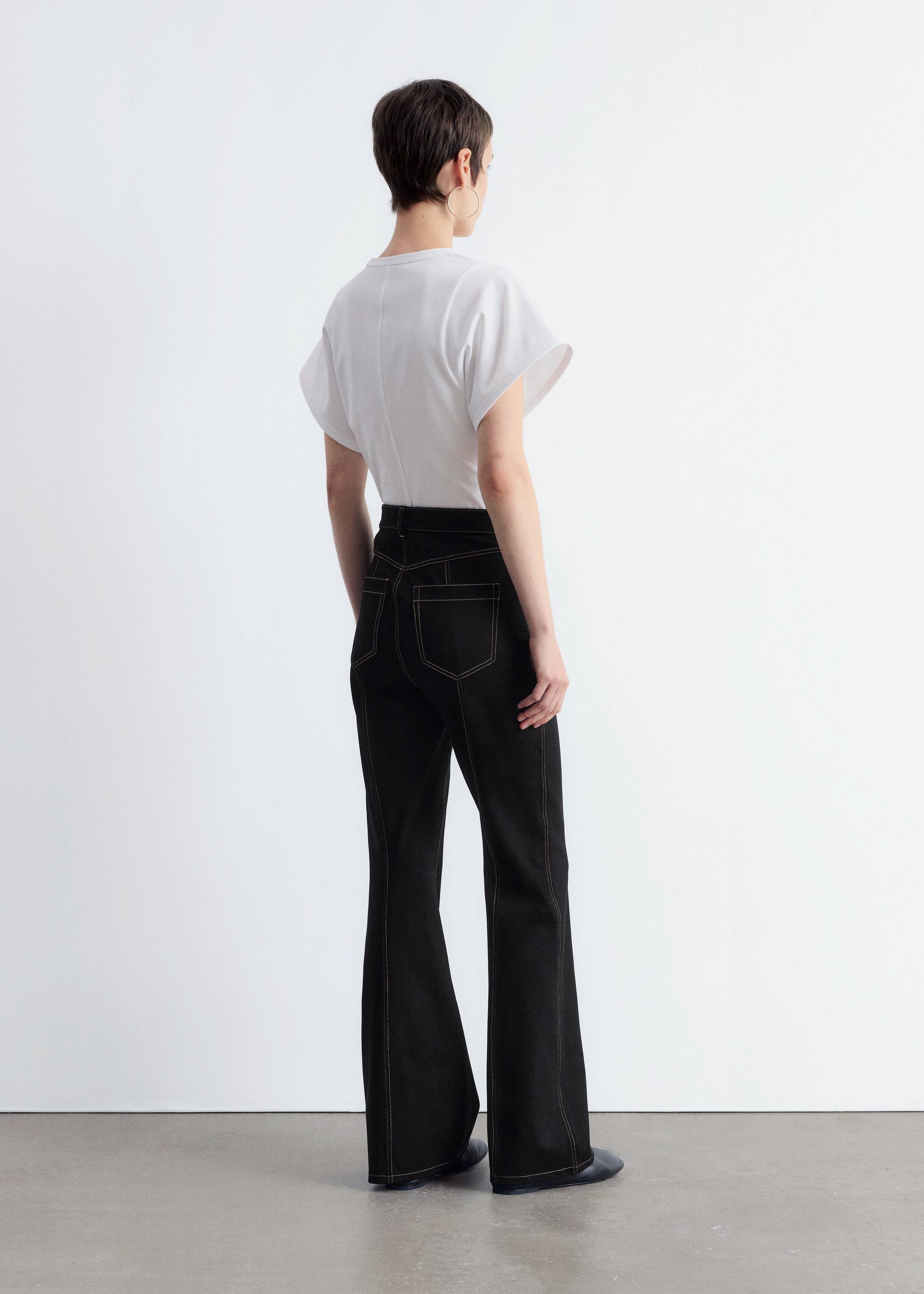 Visa större bild: Utsvängda byxor i trikå med dekorativ söm - Svart - DAM | H&M SE 4