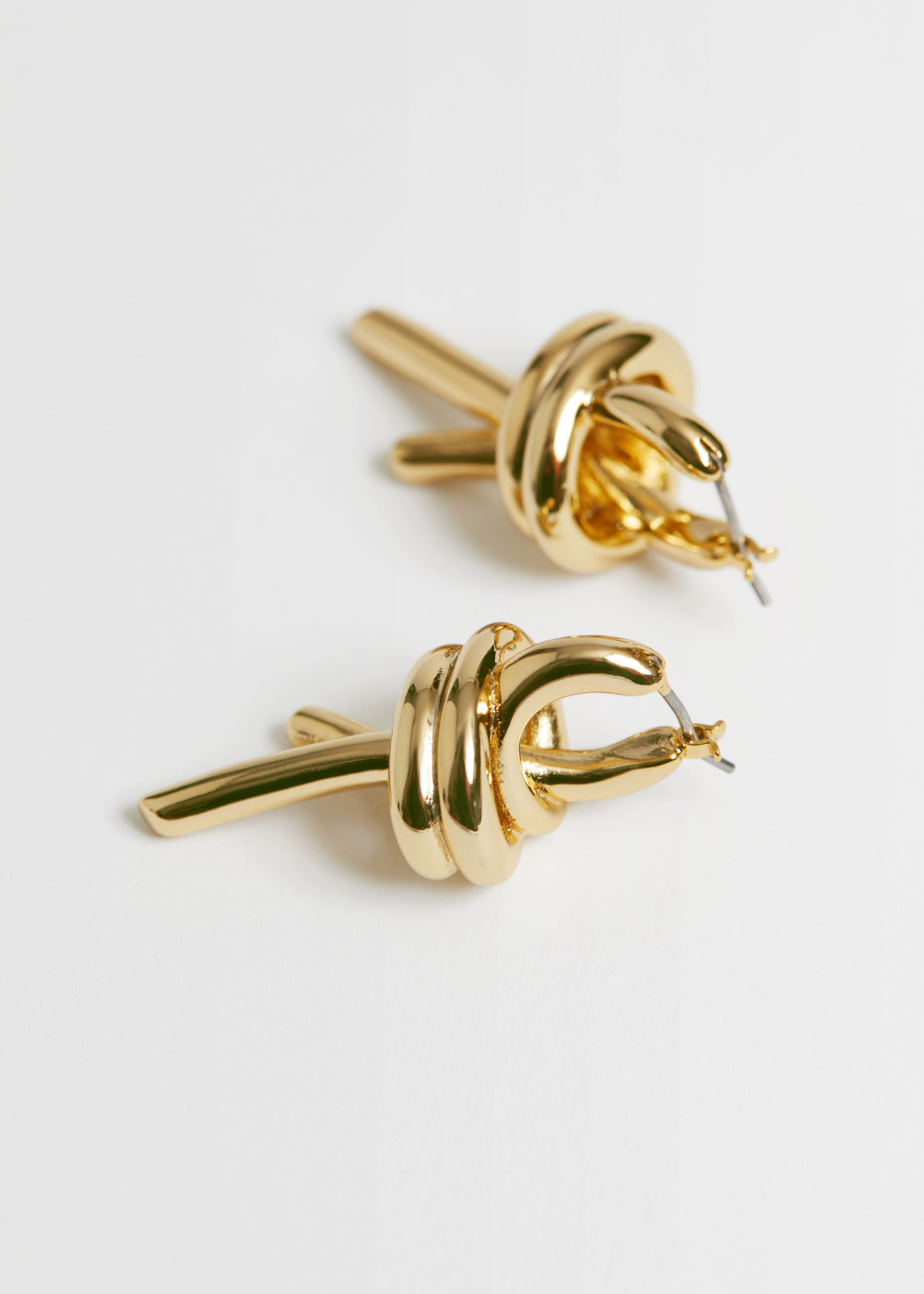 KnotEarrings - {{variantName}} - Detalle descriptivo