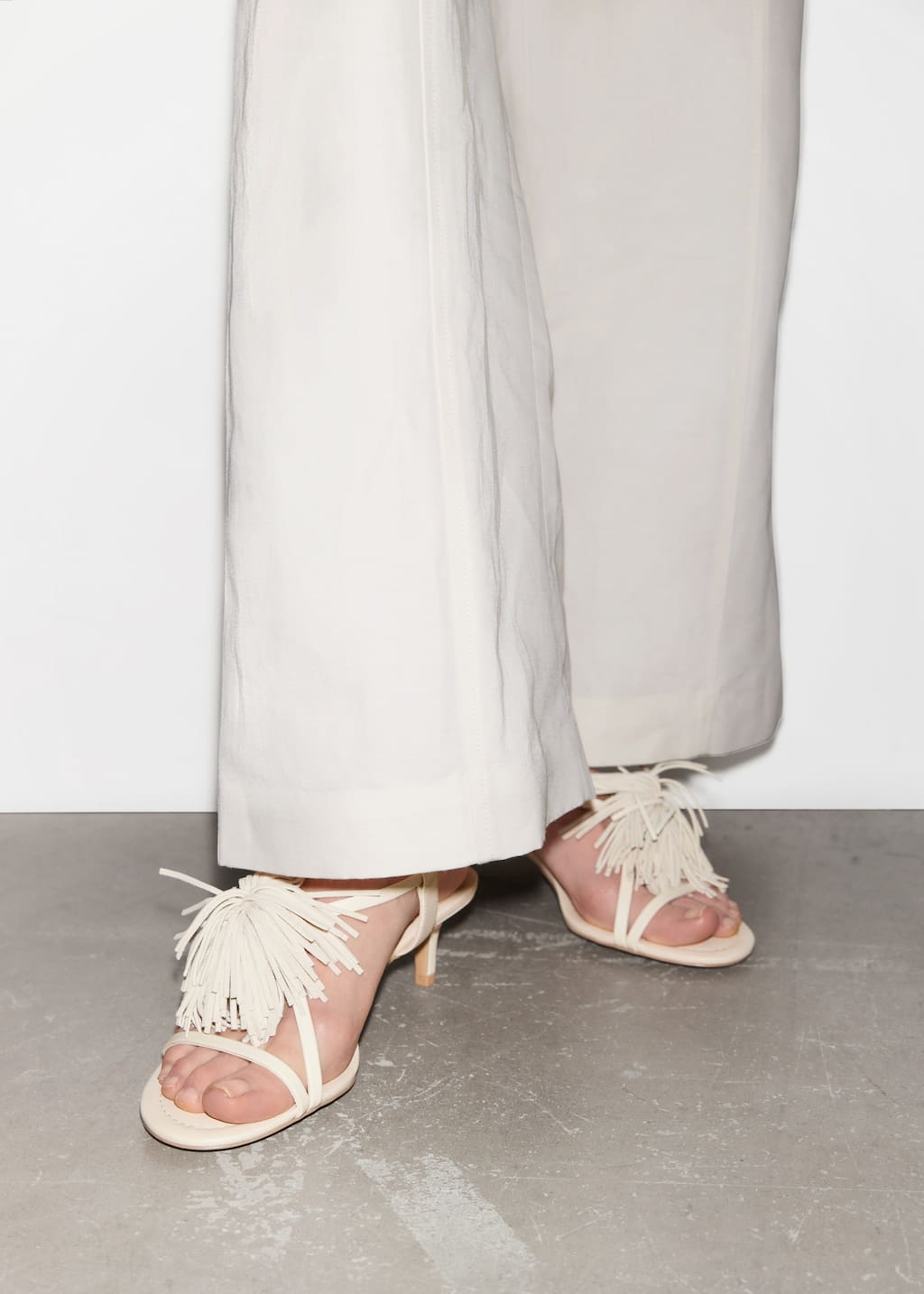 Image of Sandali in pelle con frange