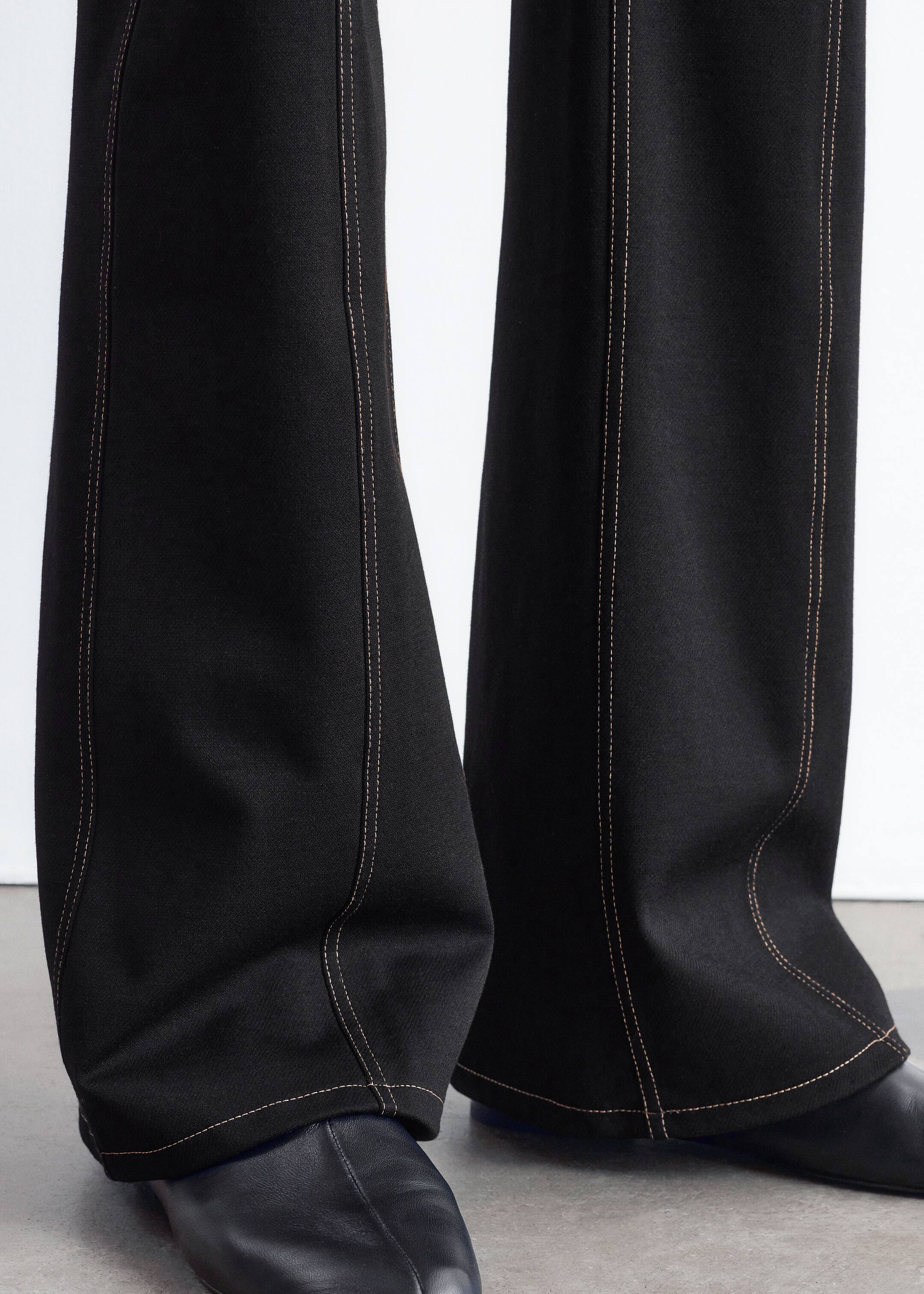 Visa större bild: Utsvängda byxor i trikå med dekorativ söm - Svart - DAM | H&M SE 6