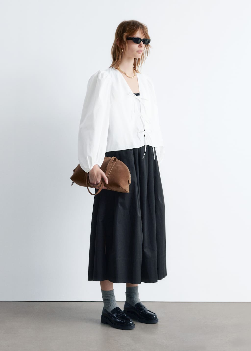 Image of Blusa annodata sul davanti