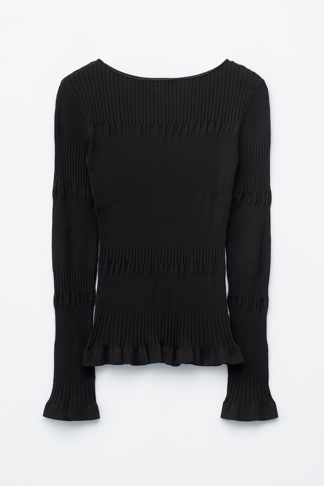 The black long-sleeved top presents a slim silhouette from the front, featuring a wide neckline, varying horizontal rib patterns across the chest, body and sleeves, and subtle frill detailing at the hem and cuffs. - 1