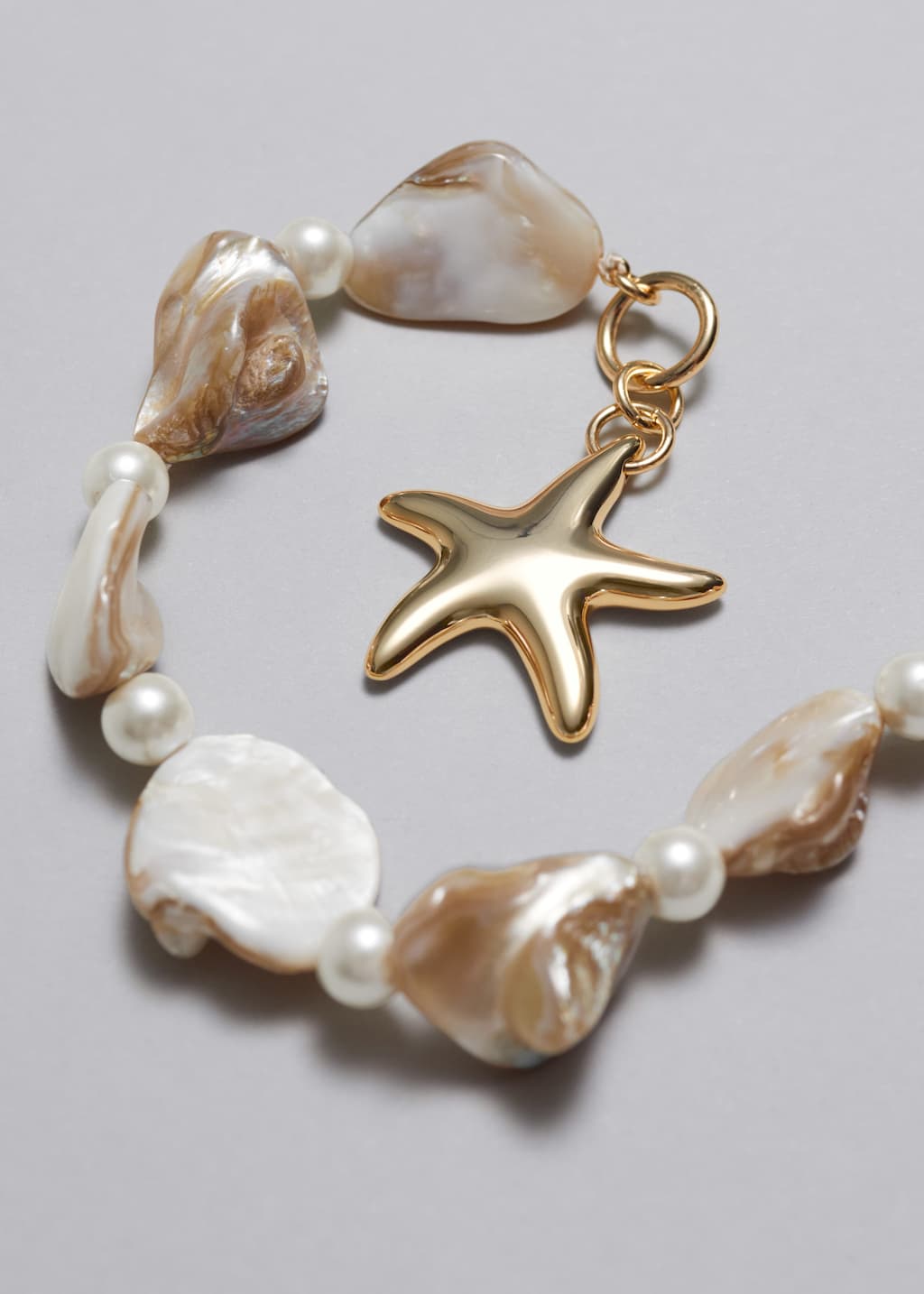 Image of Pulsera con conchas y estrella de mar