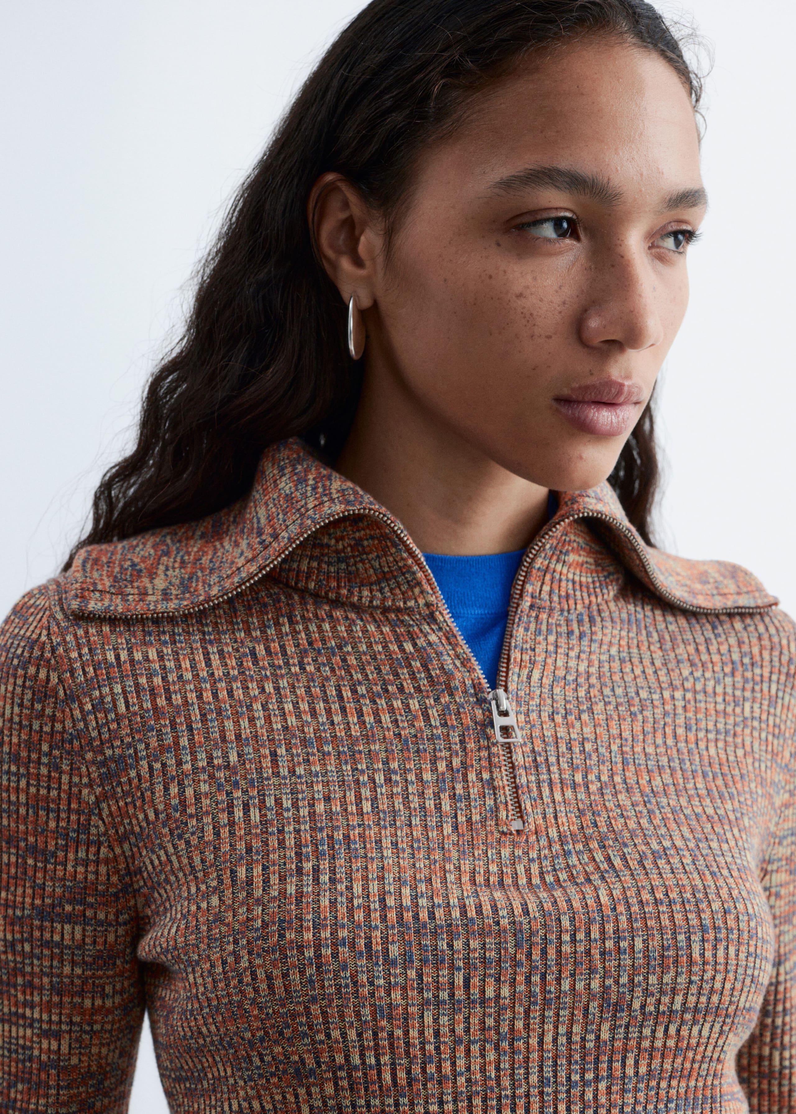 Image of Melangestickad topp med halv dragkedja