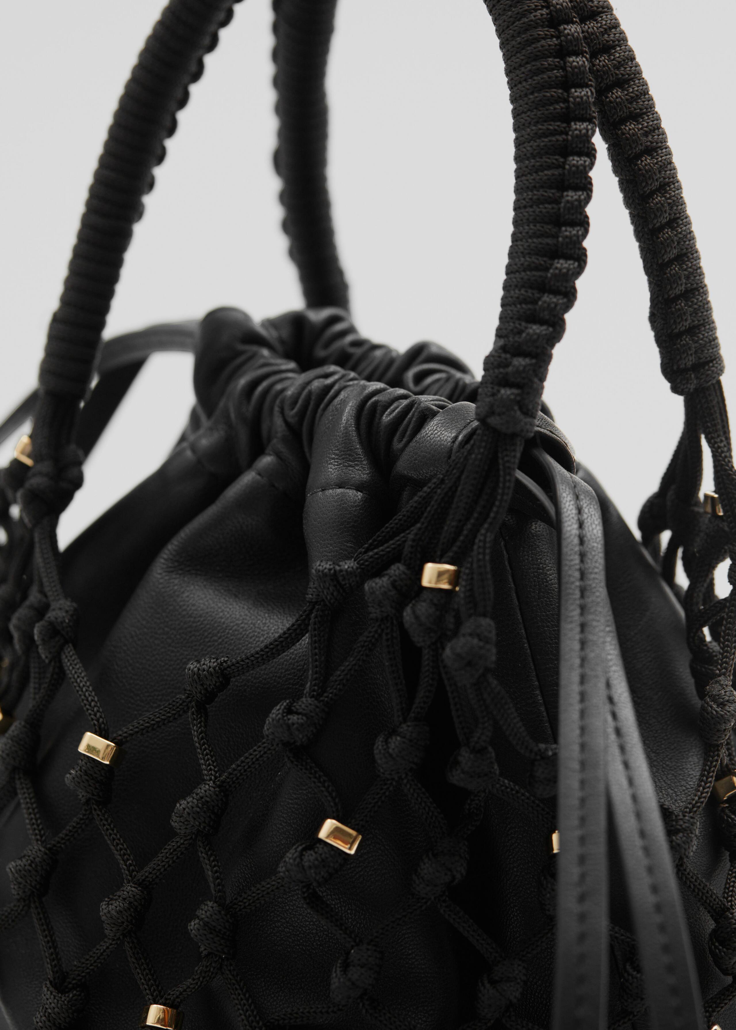 BraidedLeatherPouch - {{variantName}} - Descrizione dettagliata