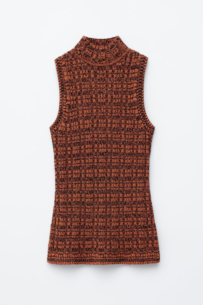 A sleeveless top is featured at the FRONT, showcasing a mock neck and a textured knit pattern in orange and black. - 1