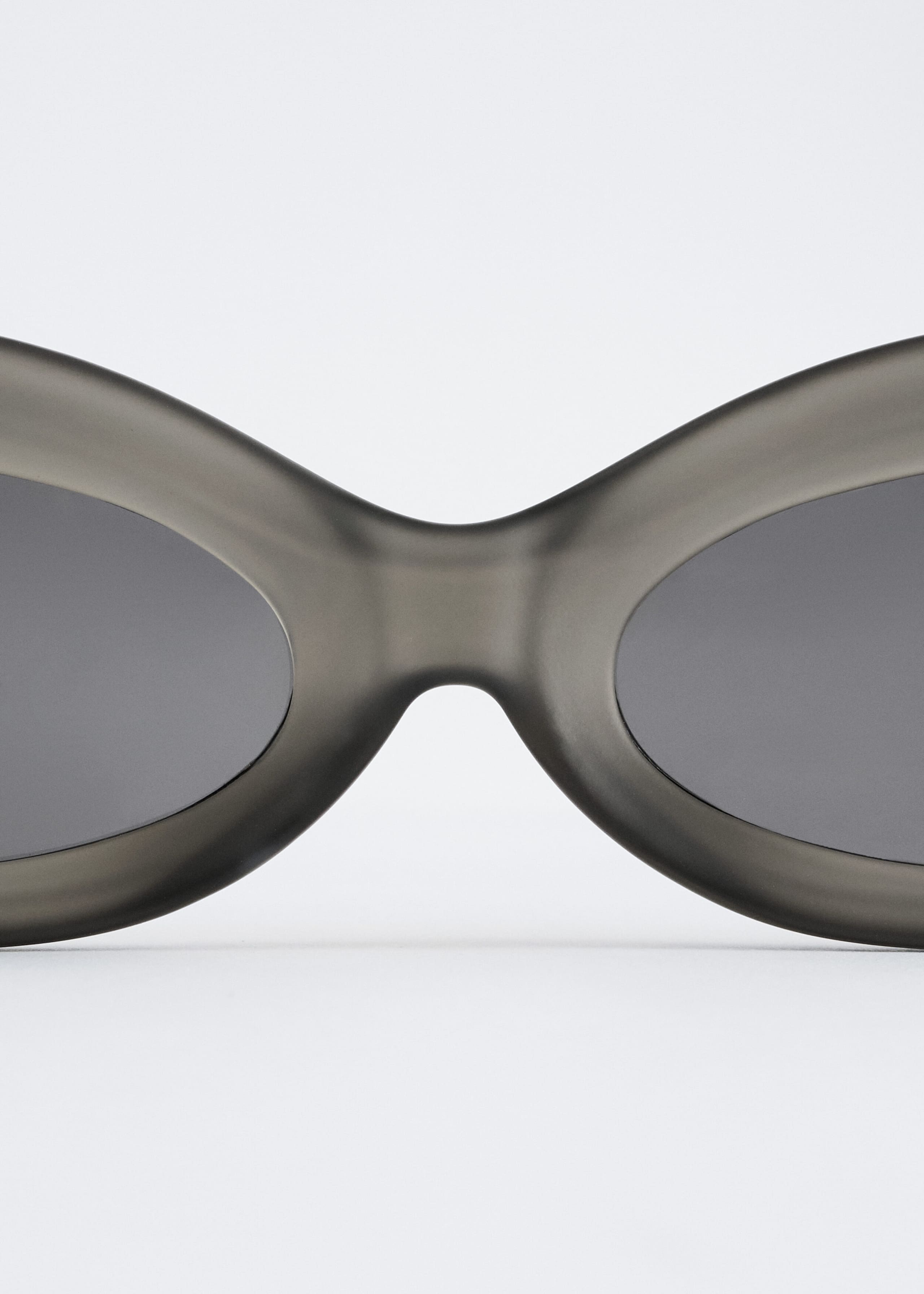 Sculpted Oval Sunglasses - {{variantName}} - Descriptive Detail