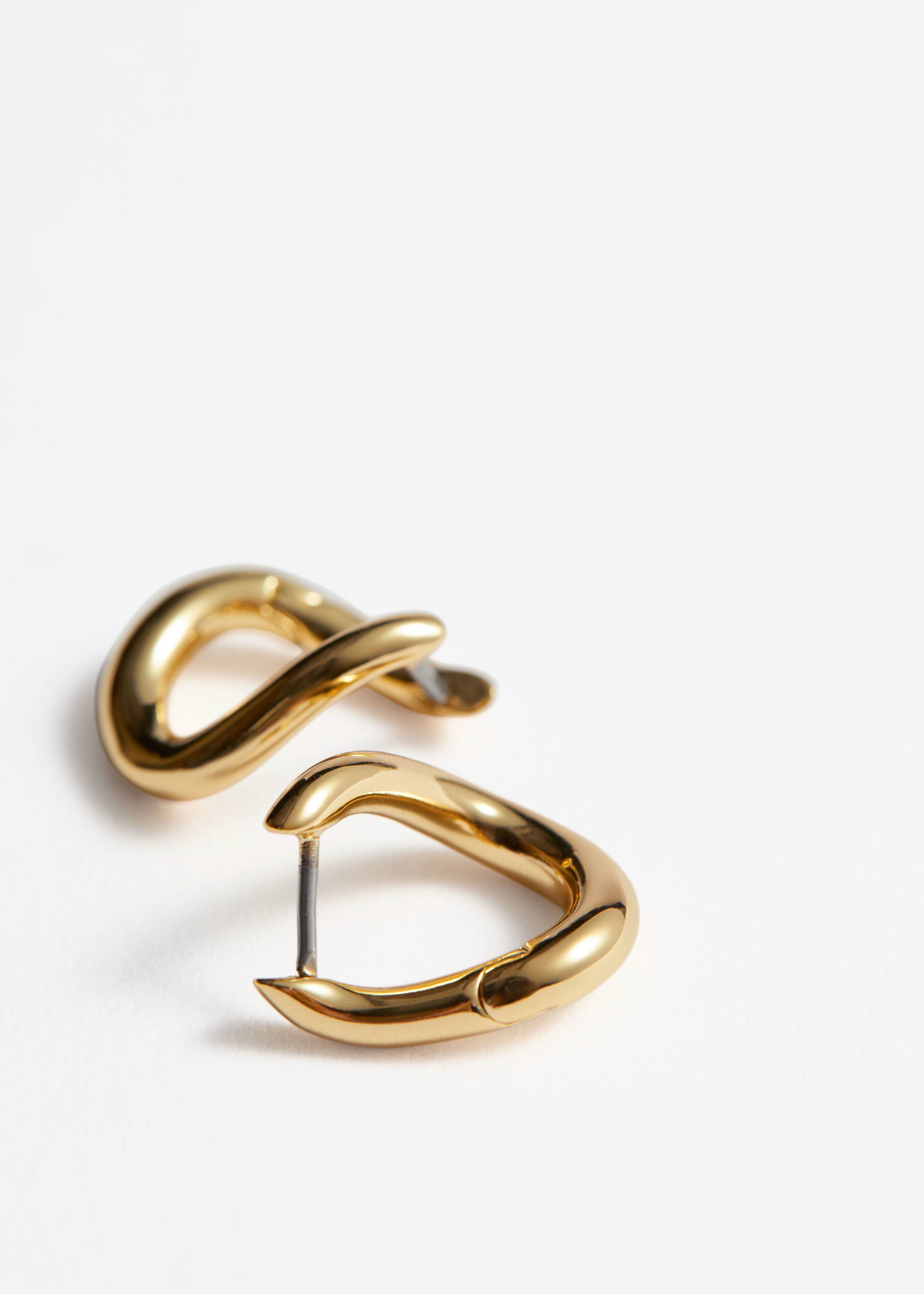 Visa större bild: Twistade hoops - Guld - DAM | H&M FI 2