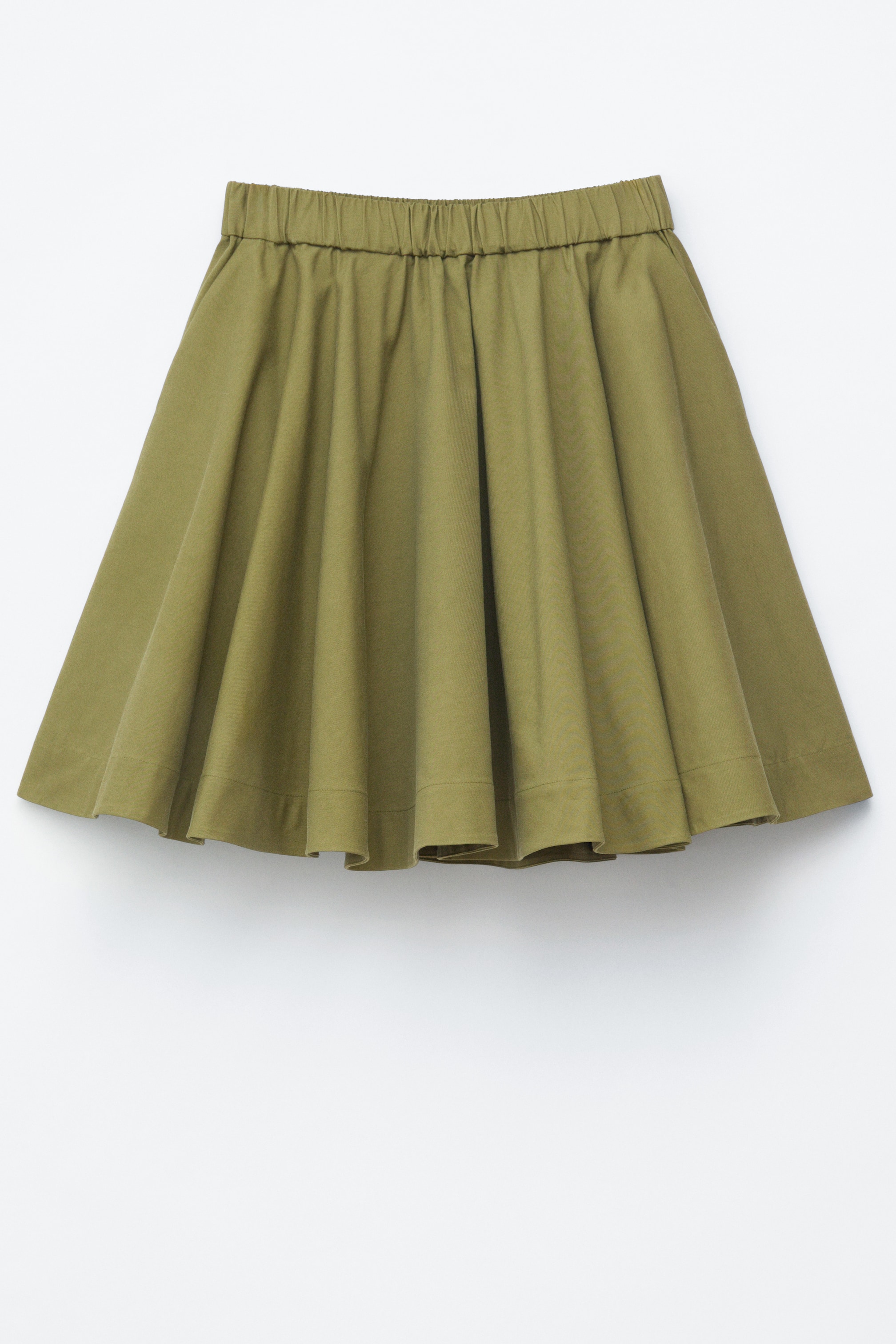 View larger image: An olive green skirt is showcased from the FRONT, featuring an elasticated, gathered waistline and a flared silhouette with soft folds adding volume.