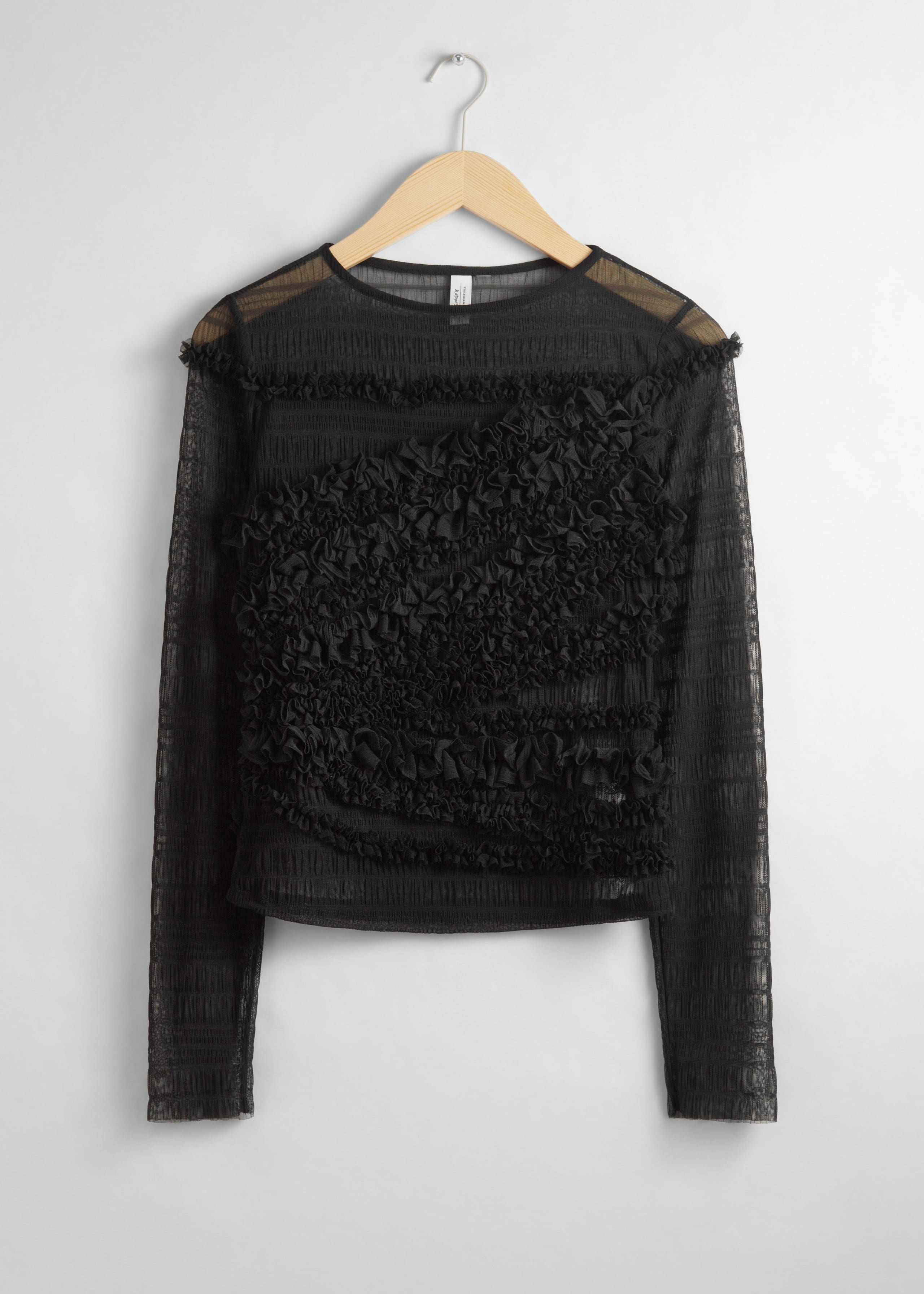 Maglia a rete dalla finitura velata con volant